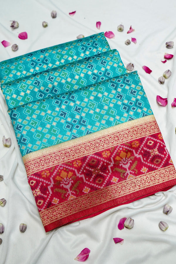 Aqua Blue Ikkat Patola Silk Saree with Rani Pink Border