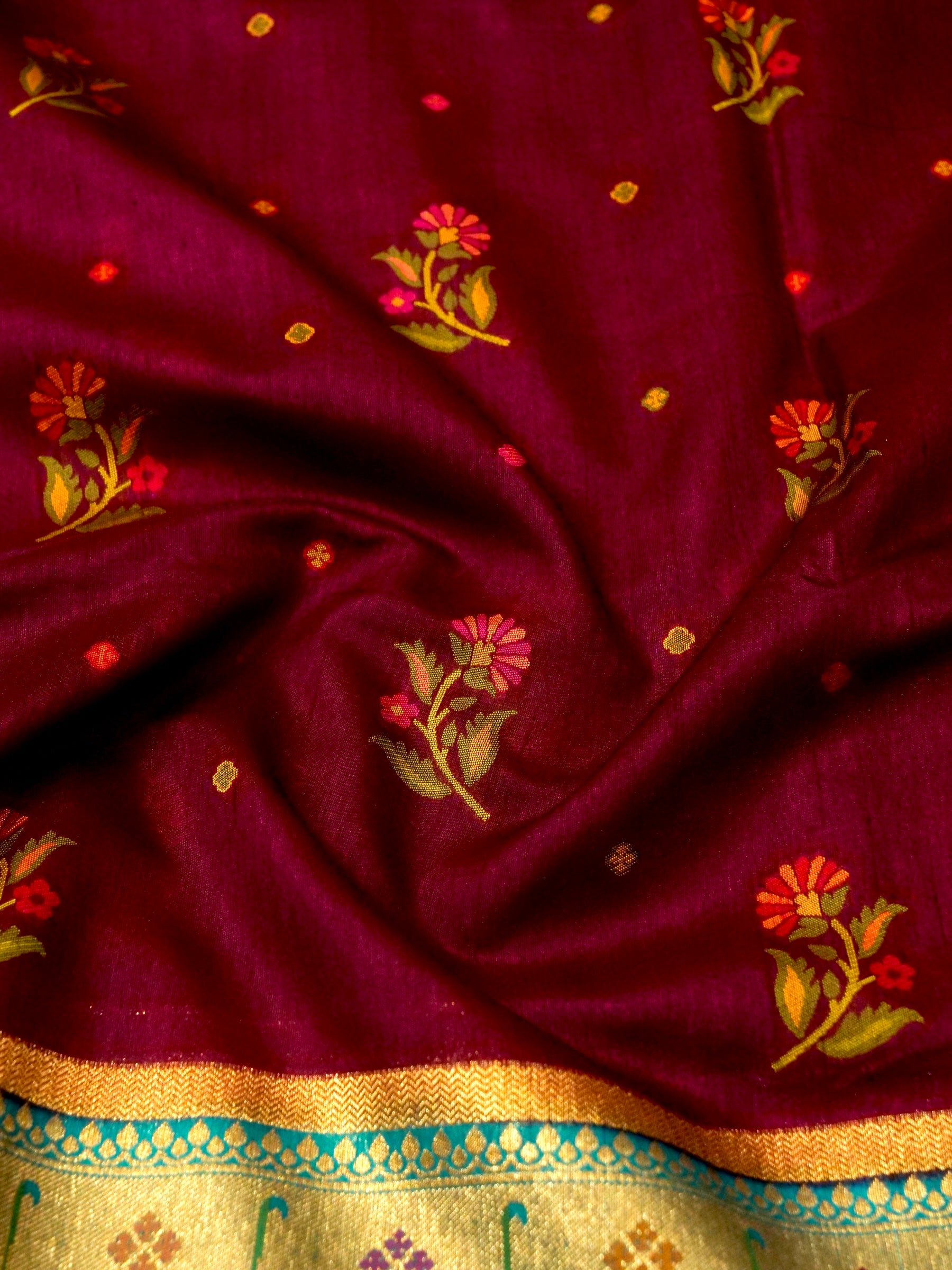 Wine Magenta Patola Silk Saree with Contrast Turquoise Border and Floral Weave