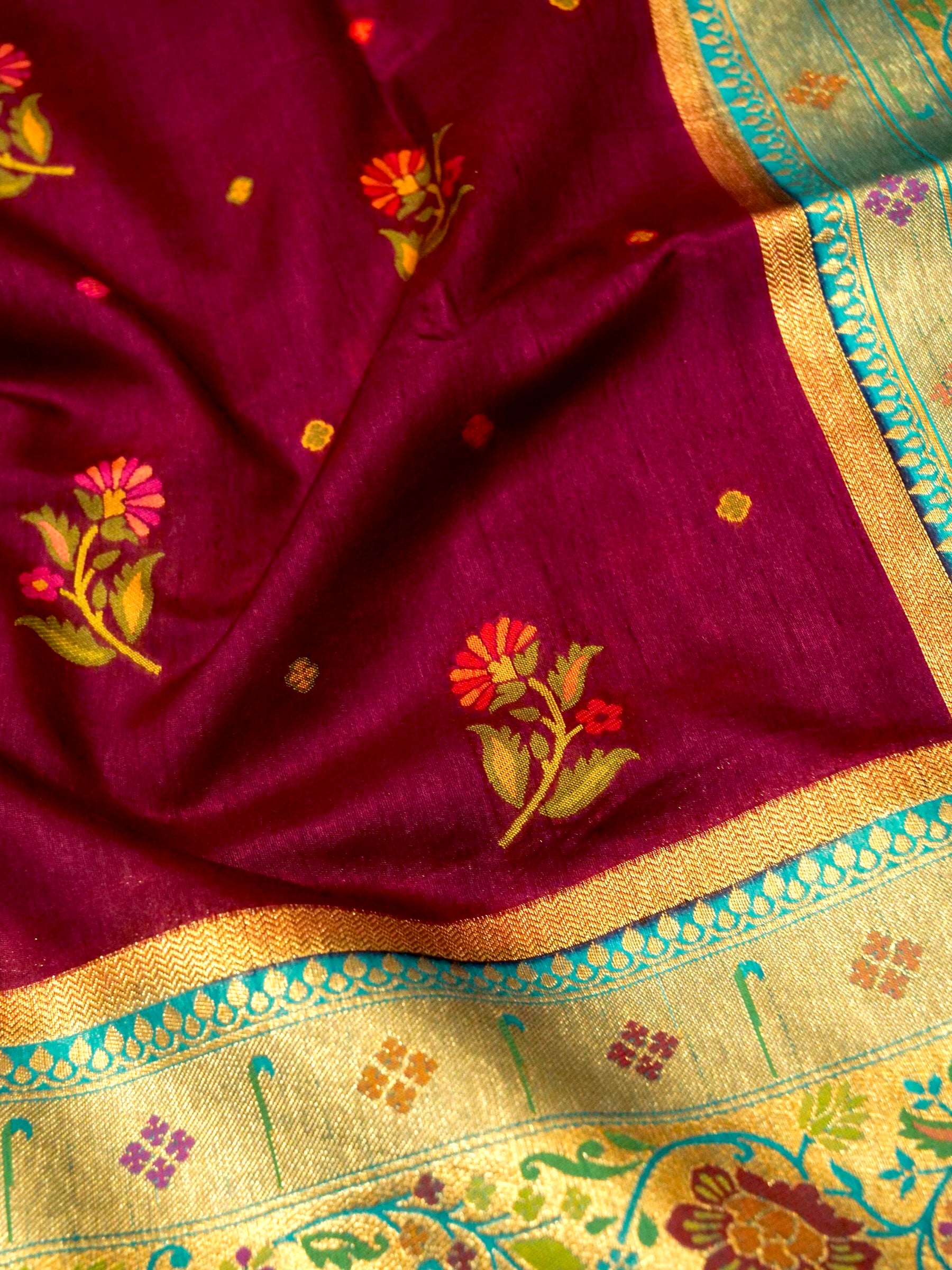 Wine Magenta Patola Silk Saree with Contrast Turquoise Border and Floral Weave
