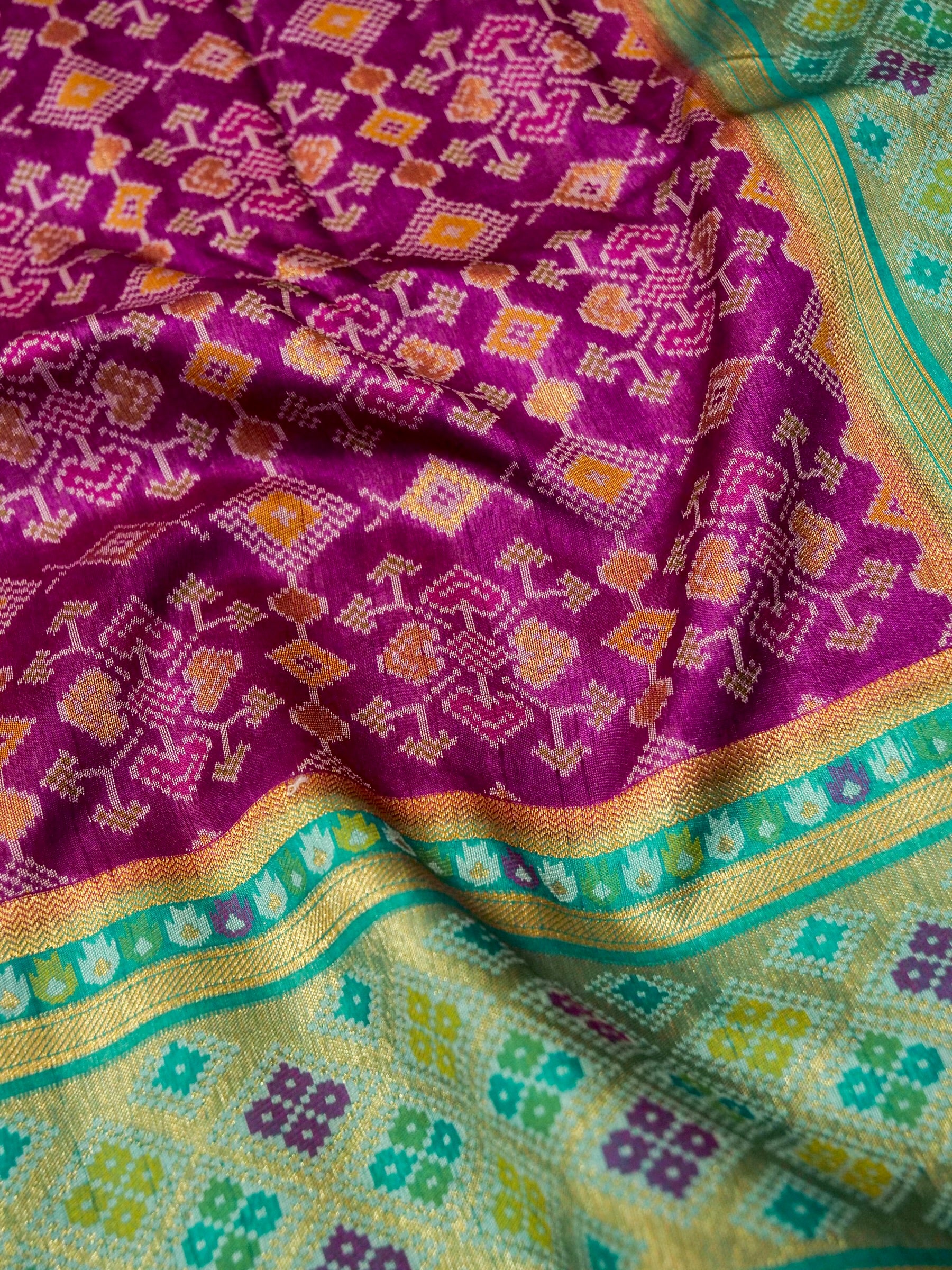 Orchid Purple Patola Silk Saree with Contrast Turquoise Blue Border