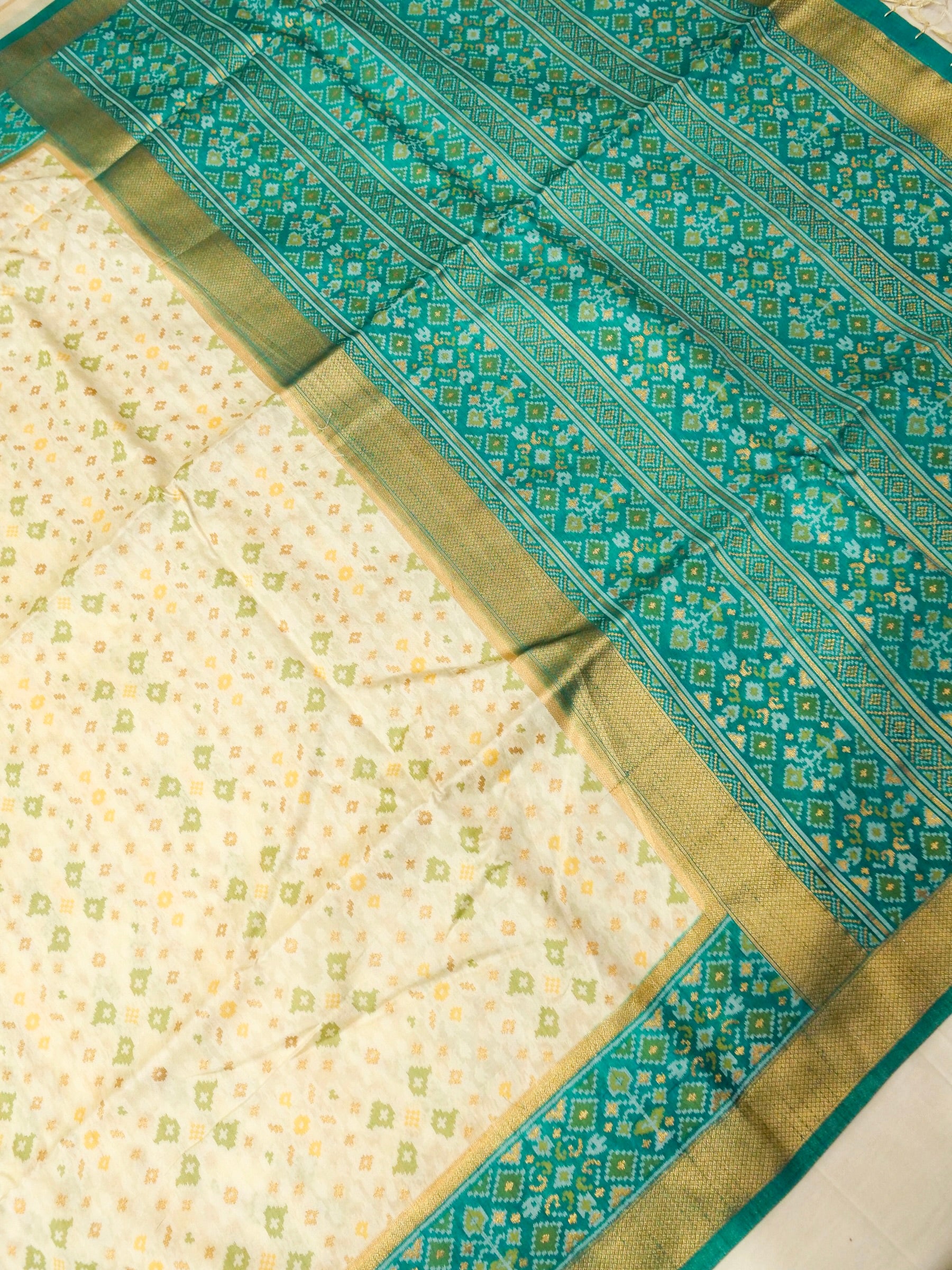 Soft Ivory Patola Silk Saree with Turquoise Green Border