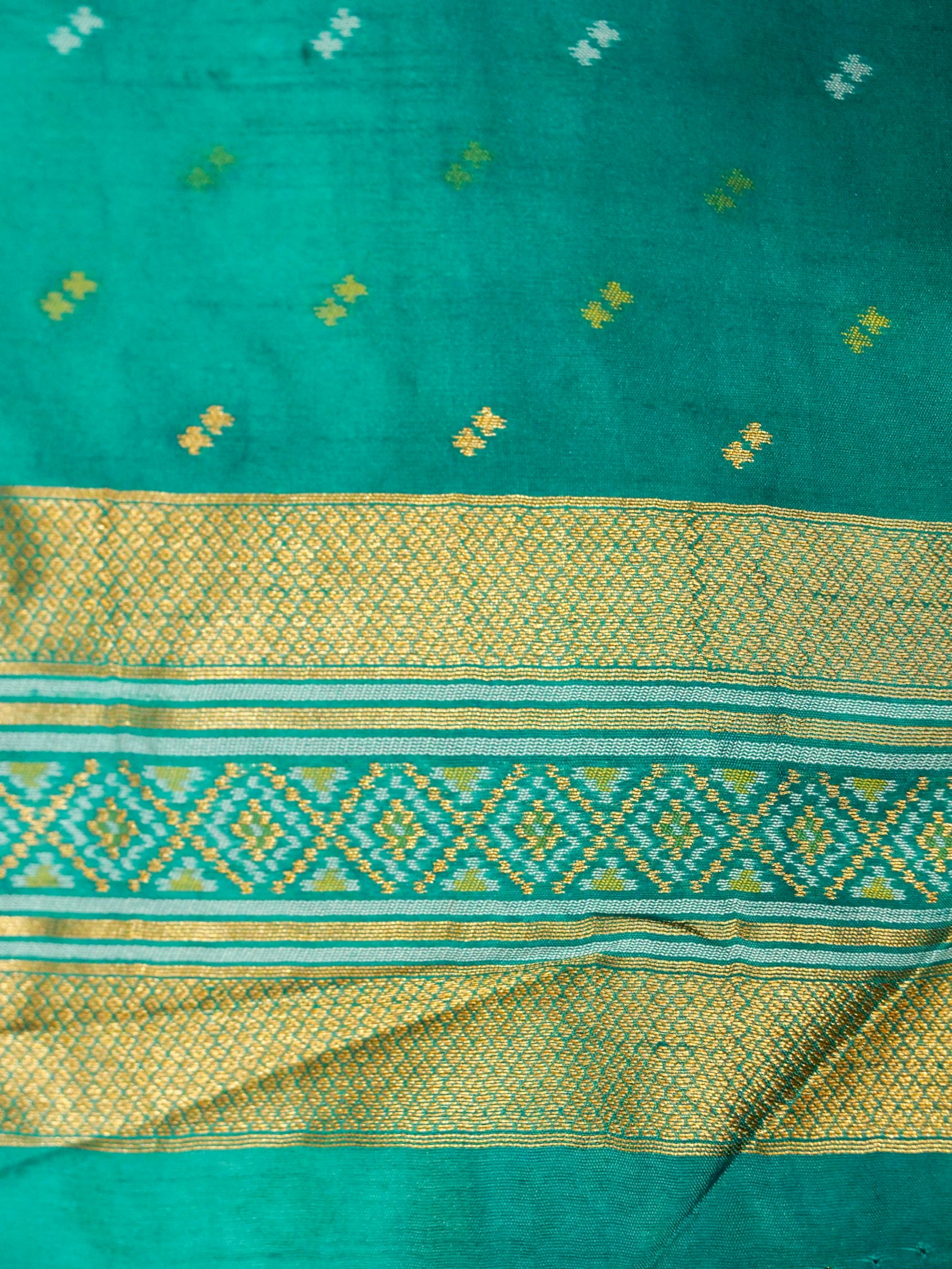 Soft Ivory Patola Silk Saree with Turquoise Green Border
