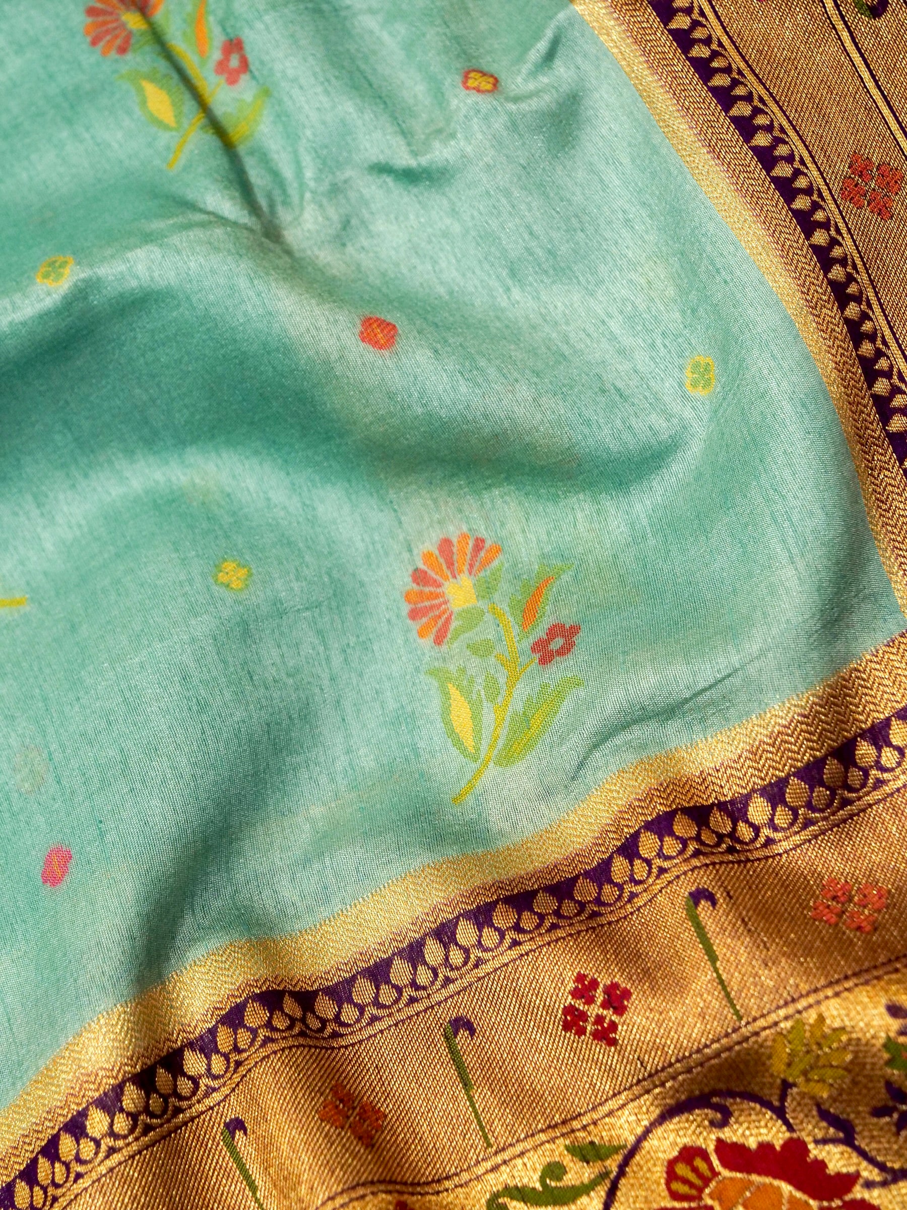 Mint Aqua Patola Silk Saree with Contrast Purple Floral Zari Border