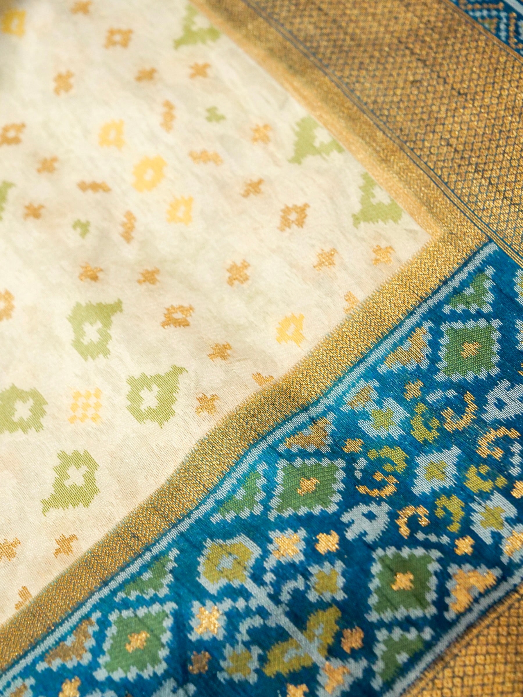 Soft Ivory Patola Silk Saree with Peacock Blue Border