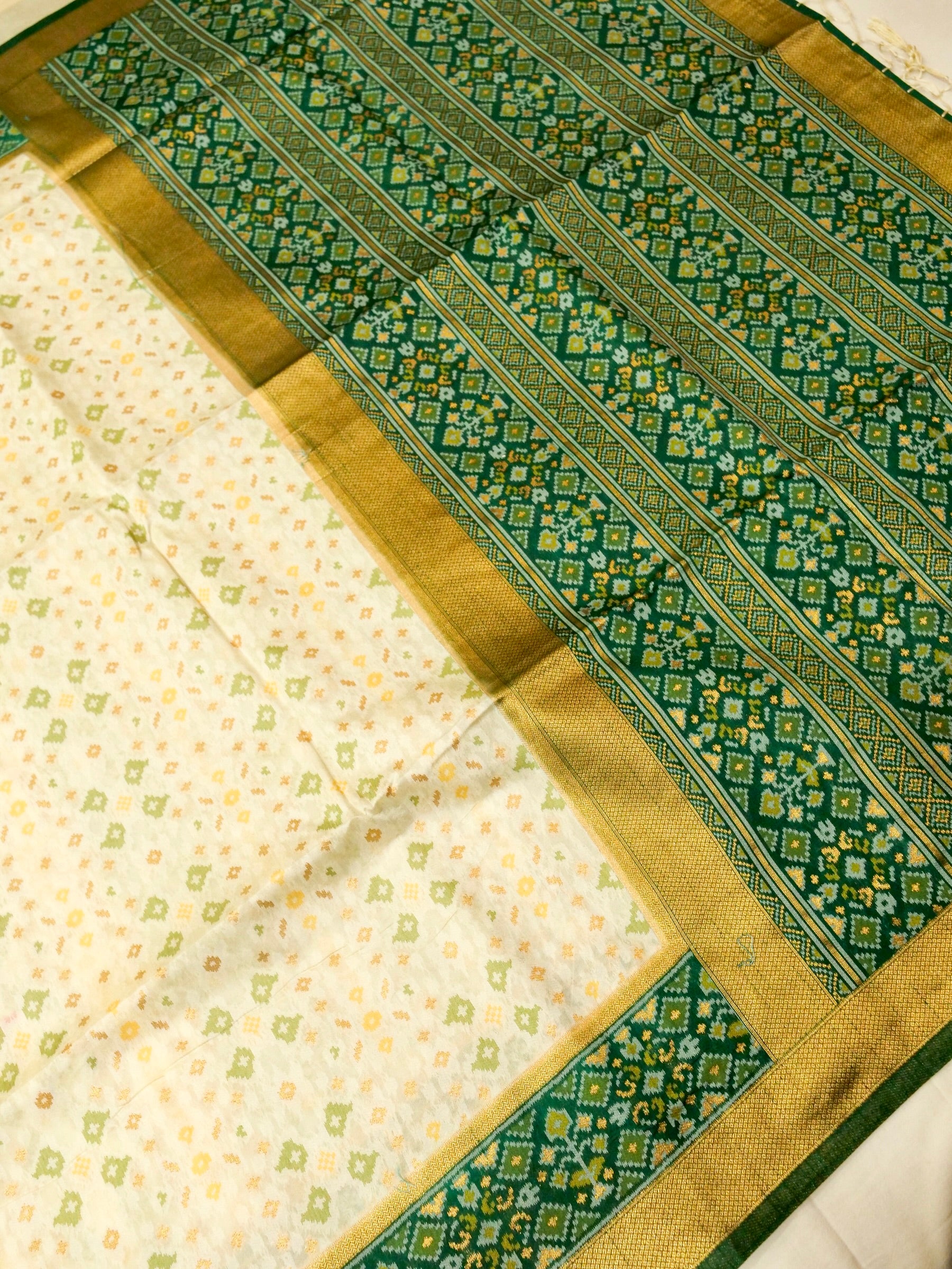 Soft Ivory Patola Silk Saree with Emerald Green Border