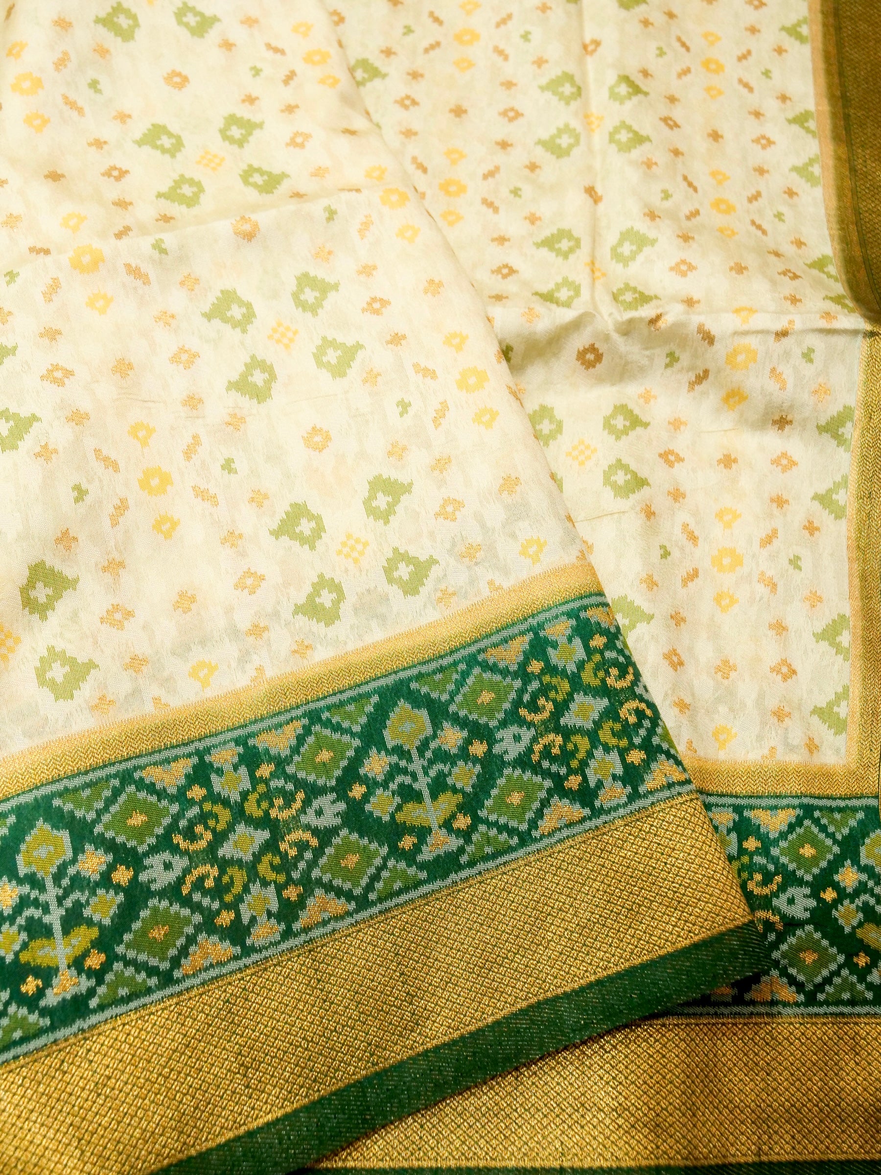 Soft Ivory Patola Silk Saree with Emerald Green Border