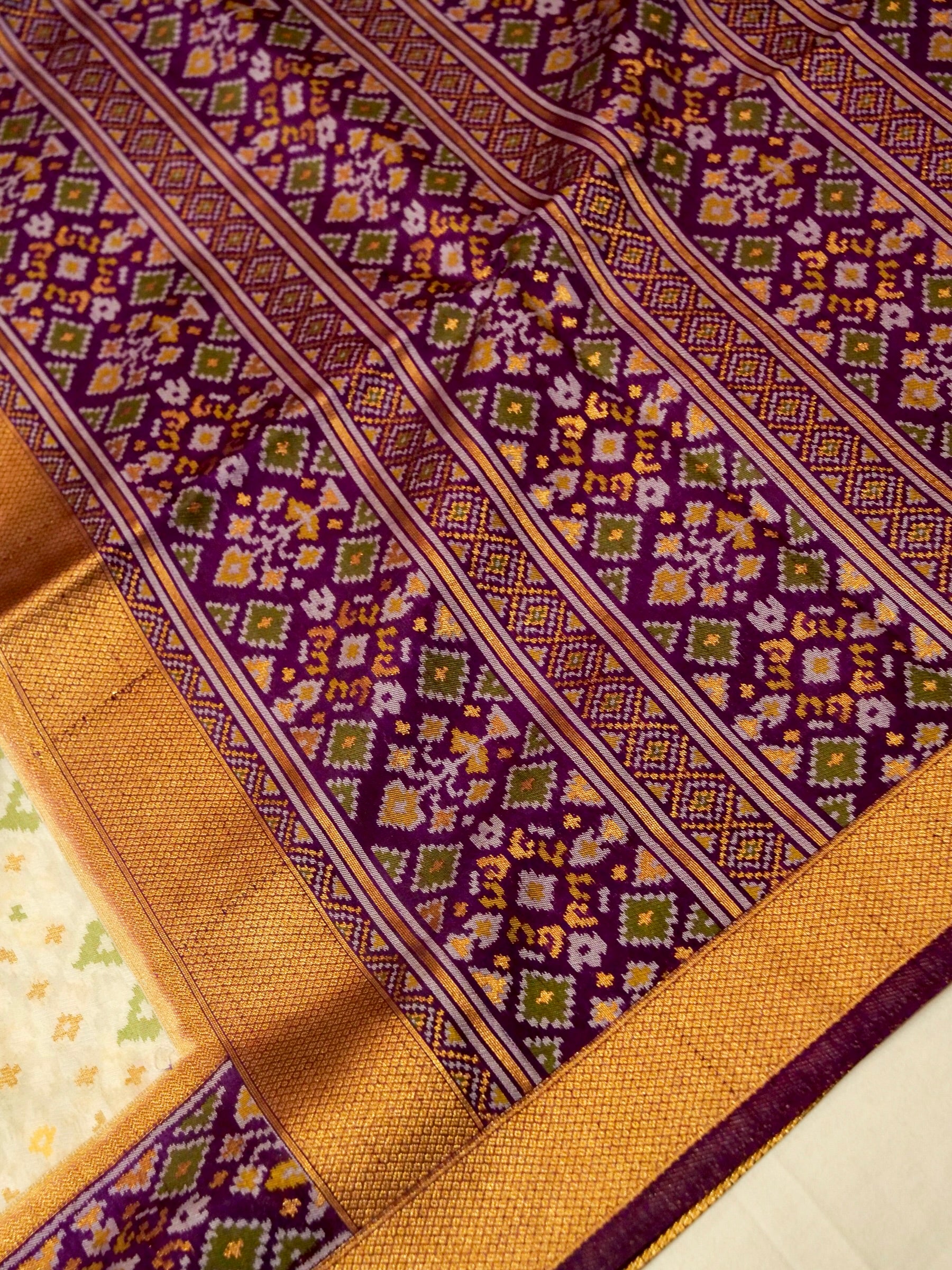 Soft Ivory Patola Silk Saree with Royal Purple Border