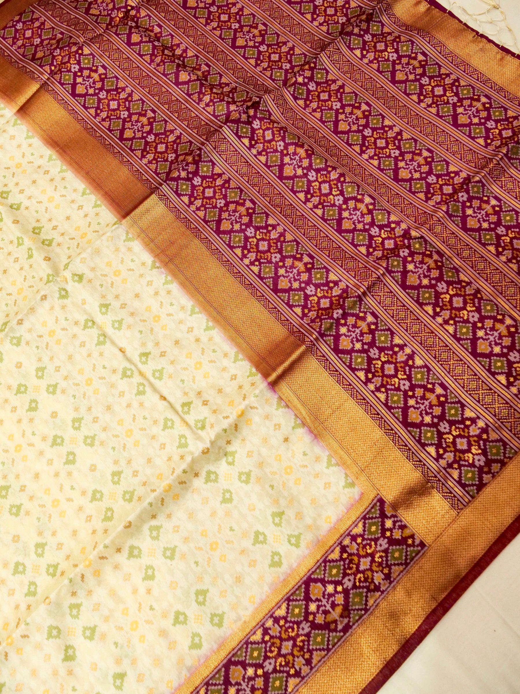 Soft Ivory Patola Silk Saree with Regal Plum Border