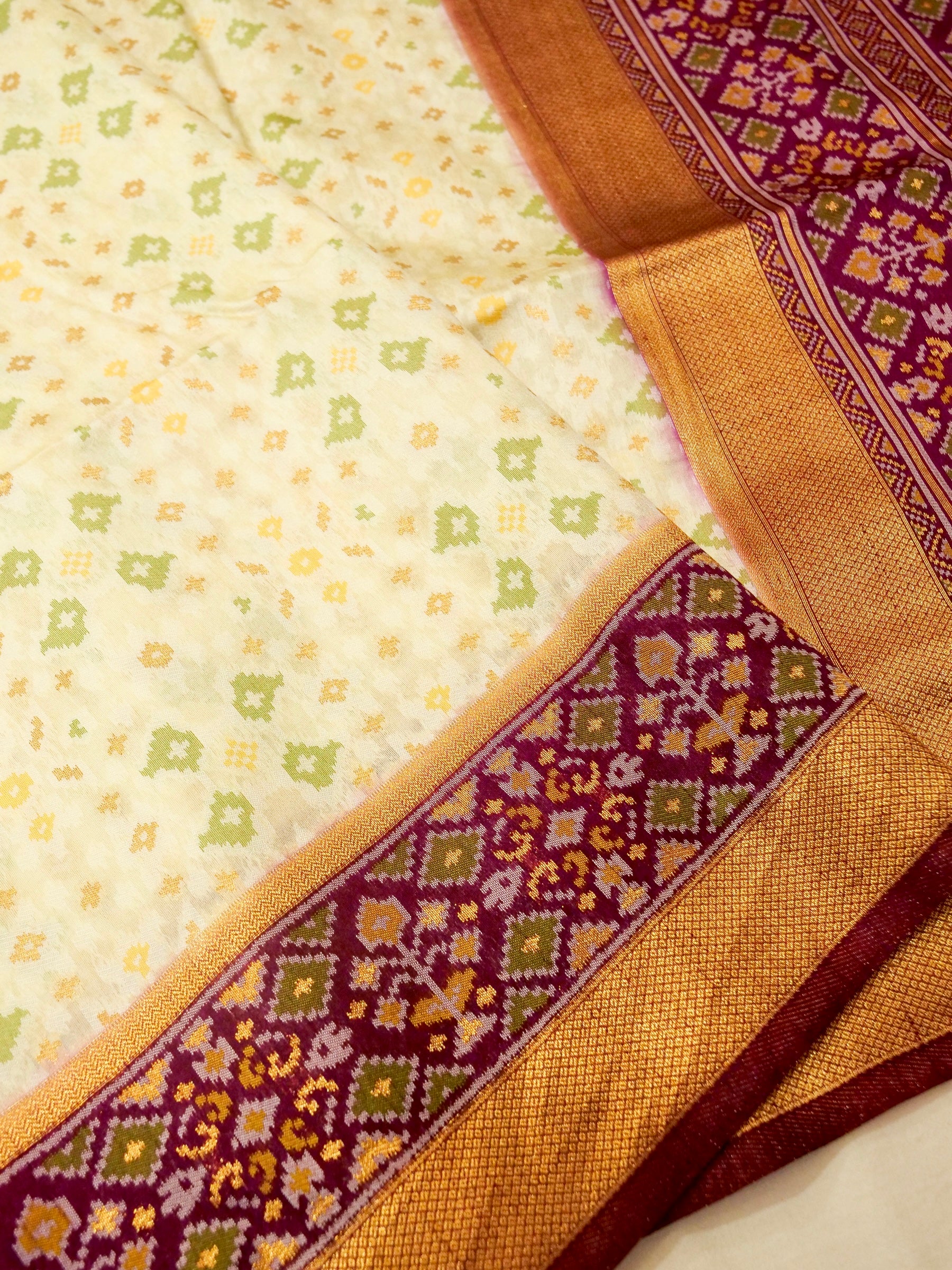 Soft Ivory Patola Silk Saree with Regal Plum Border