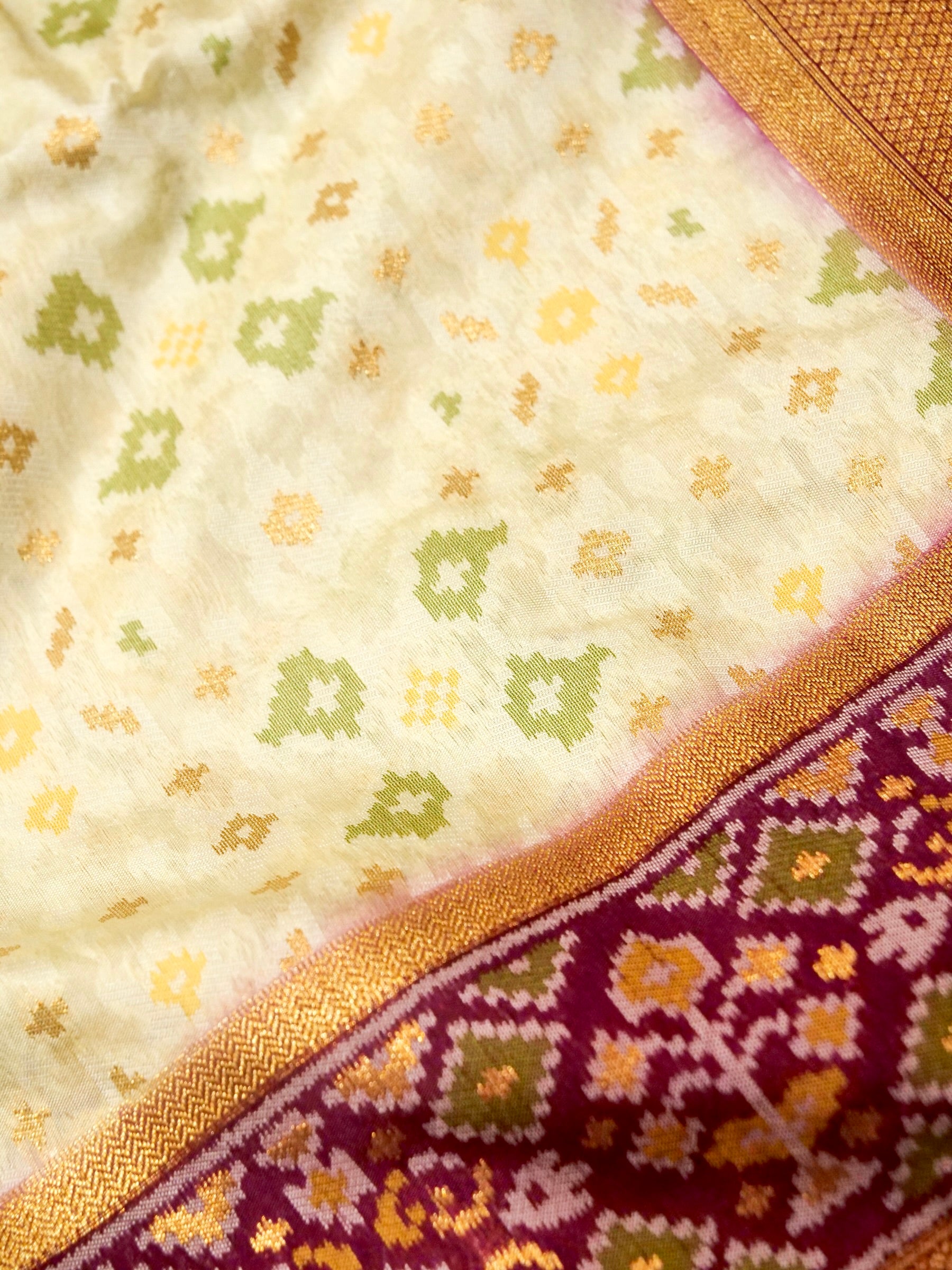 Soft Ivory Patola Silk Saree with Regal Plum Border