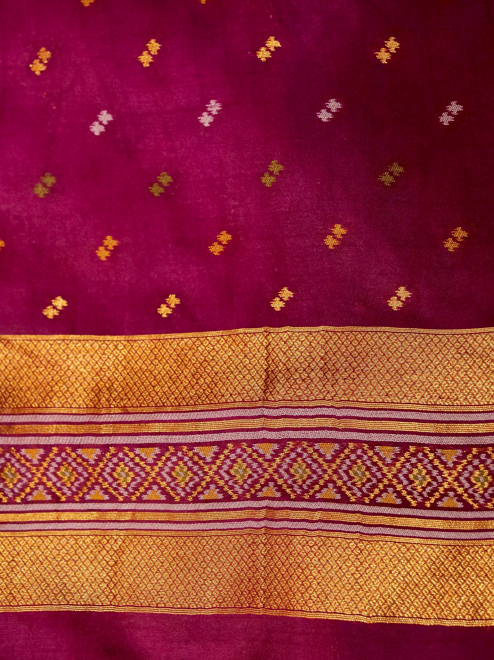 Soft Ivory Patola Silk Saree with Regal Plum Border