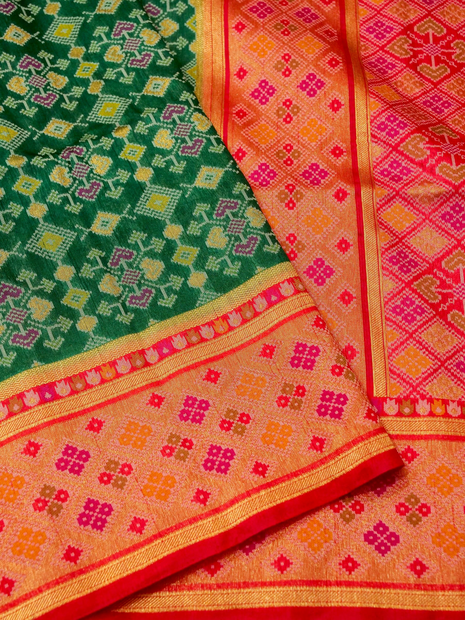 Emerald Green Patola Silk Saree with Contrast Peach Pink Border
