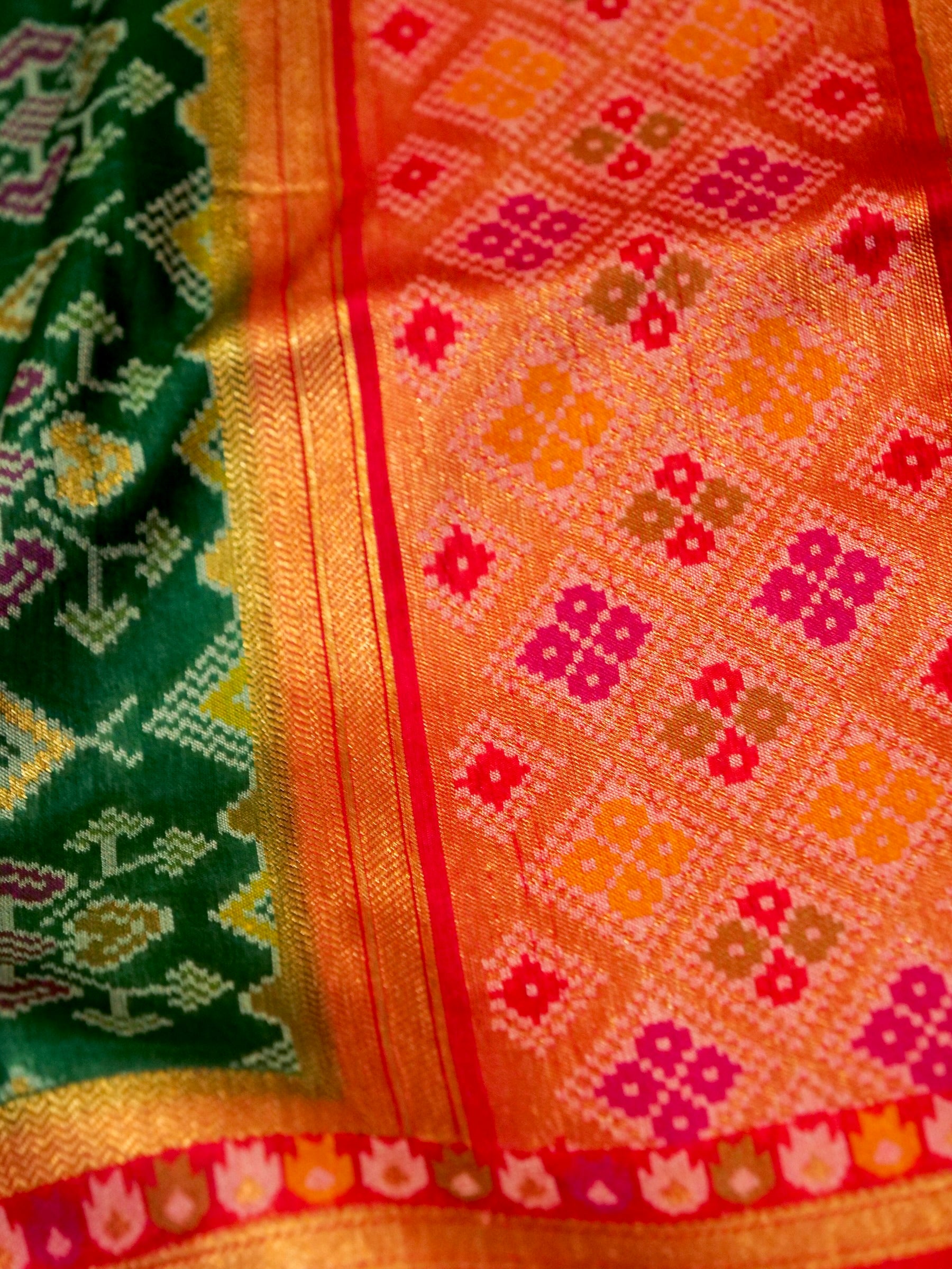 Emerald Green Patola Silk Saree with Contrast Peach Pink Border
