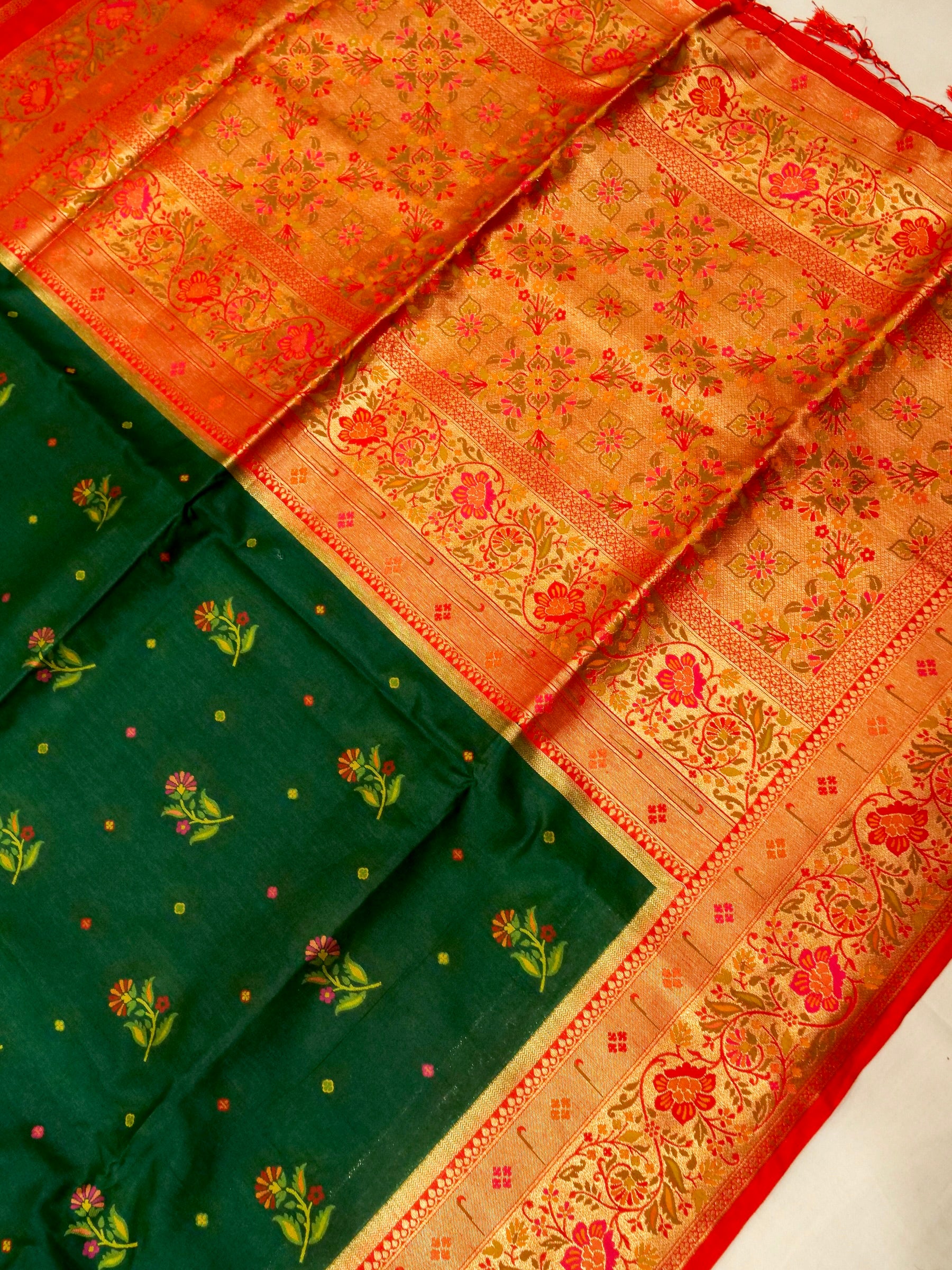 Bottle Green Patola Silk Saree with Contrast Coral Floral Zari Border