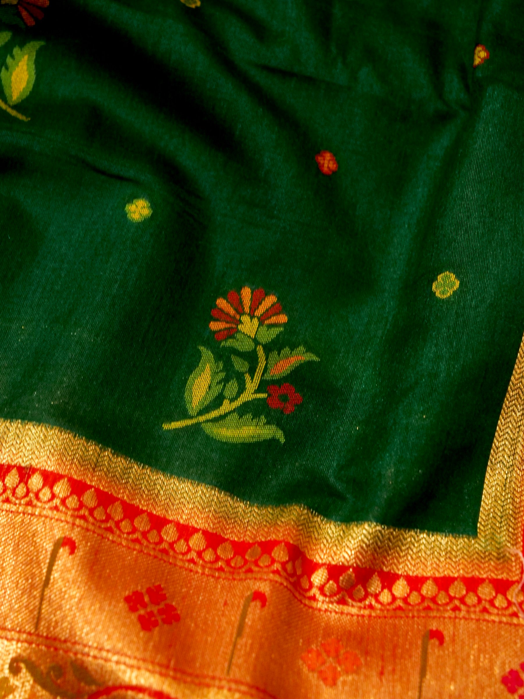 Bottle Green Patola Silk Saree with Contrast Coral Floral Zari Border
