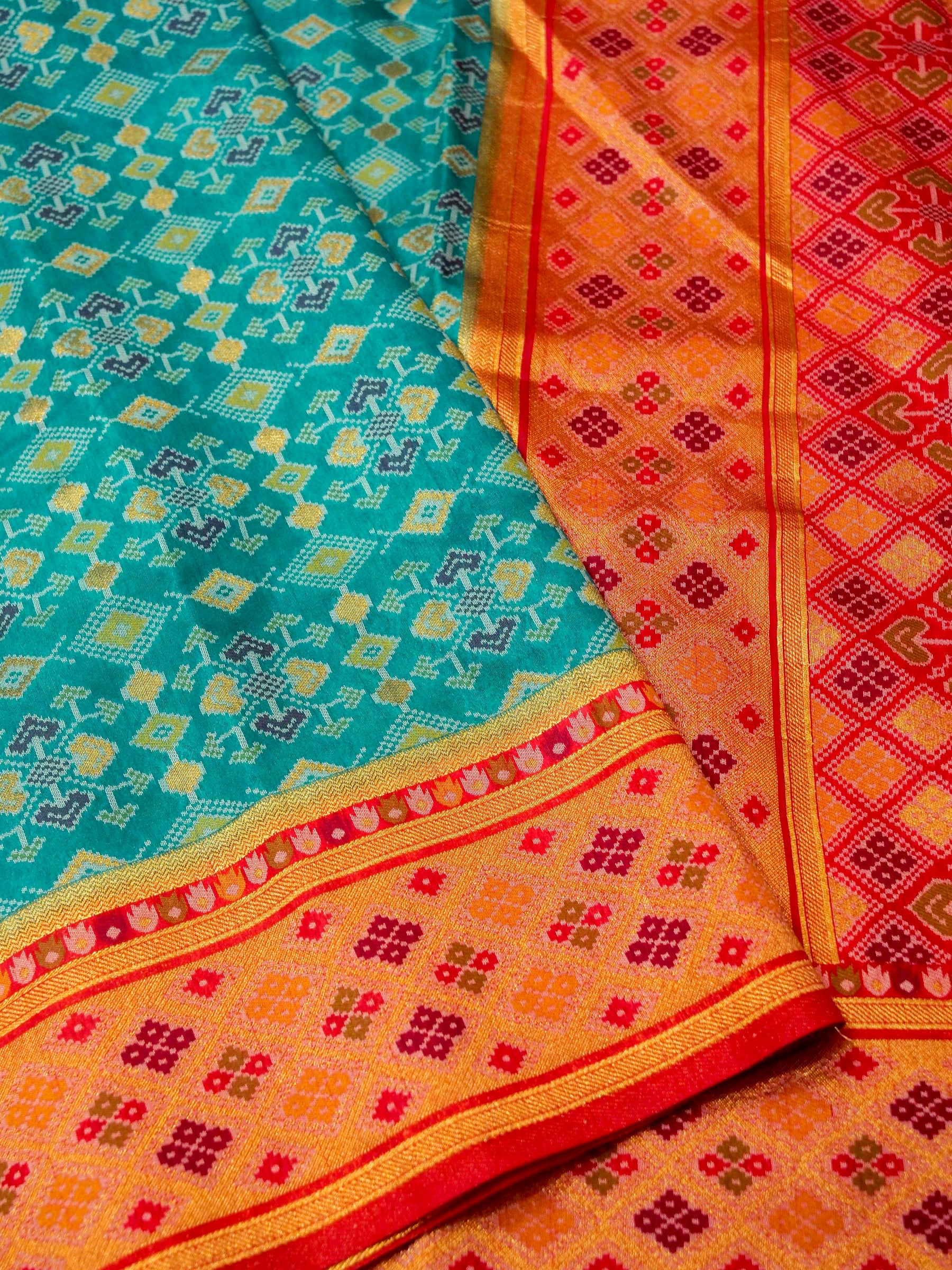 Turquoise Patola Silk Saree with Contrast Peach Pink Border
