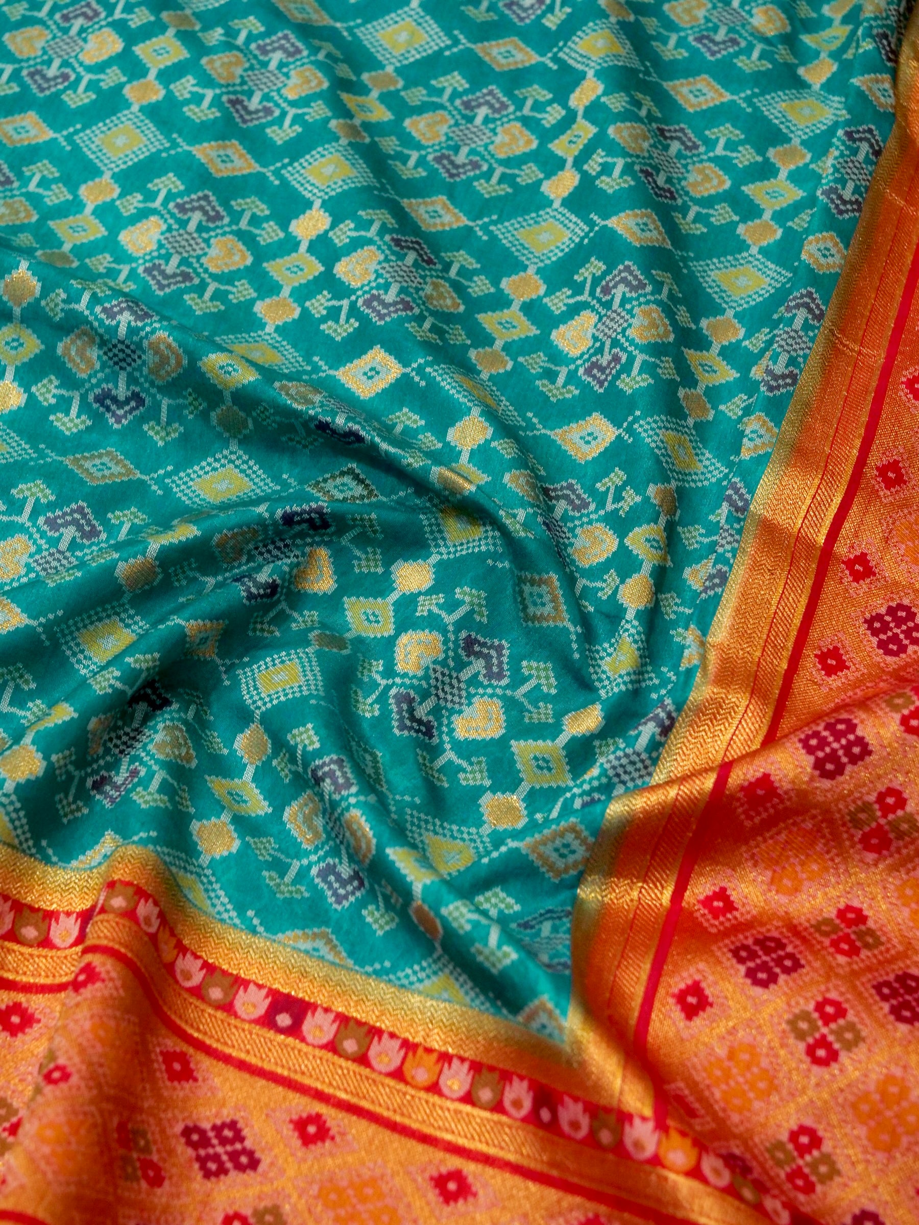 Turquoise Patola Silk Saree with Contrast Peach Pink Border