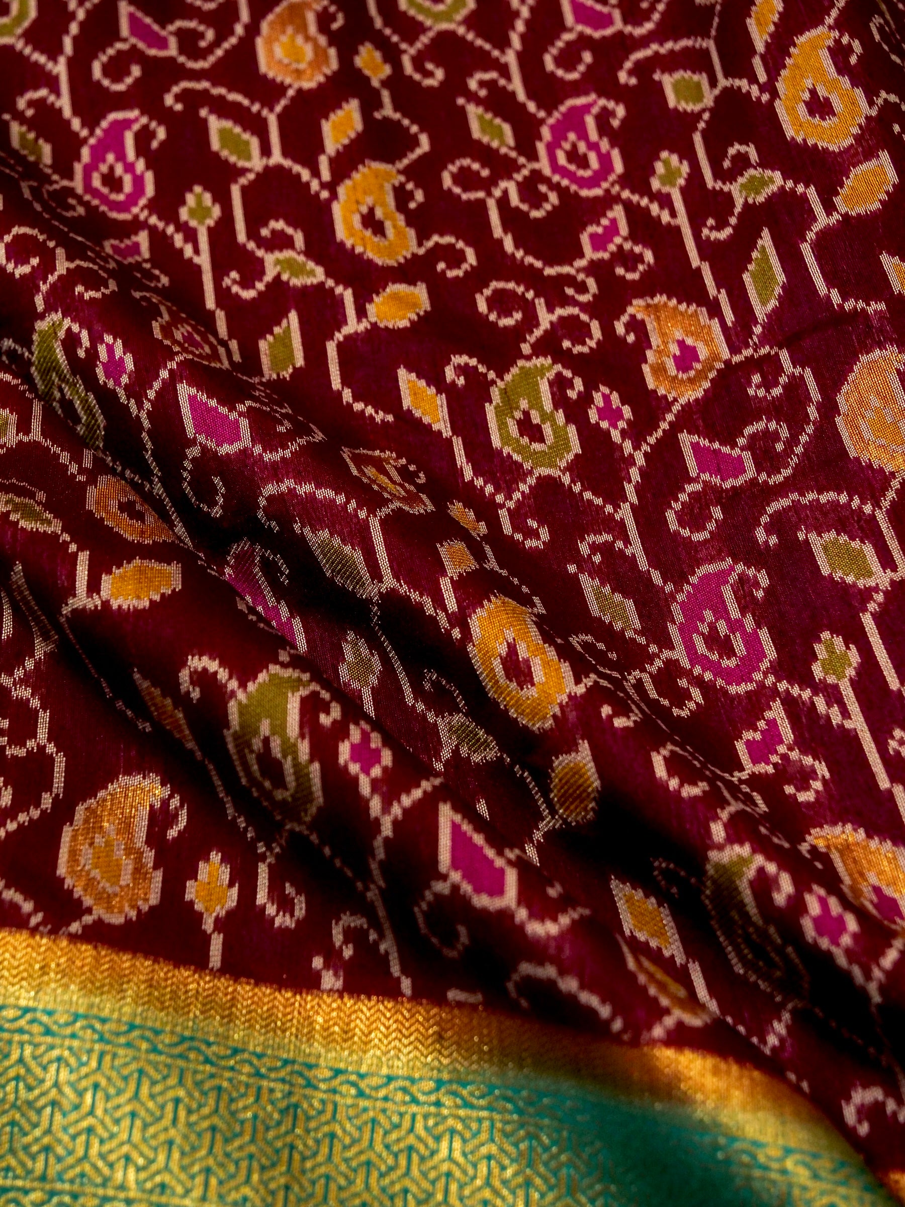 Wine Patola Silk Saree with Contrast Turquoise Border