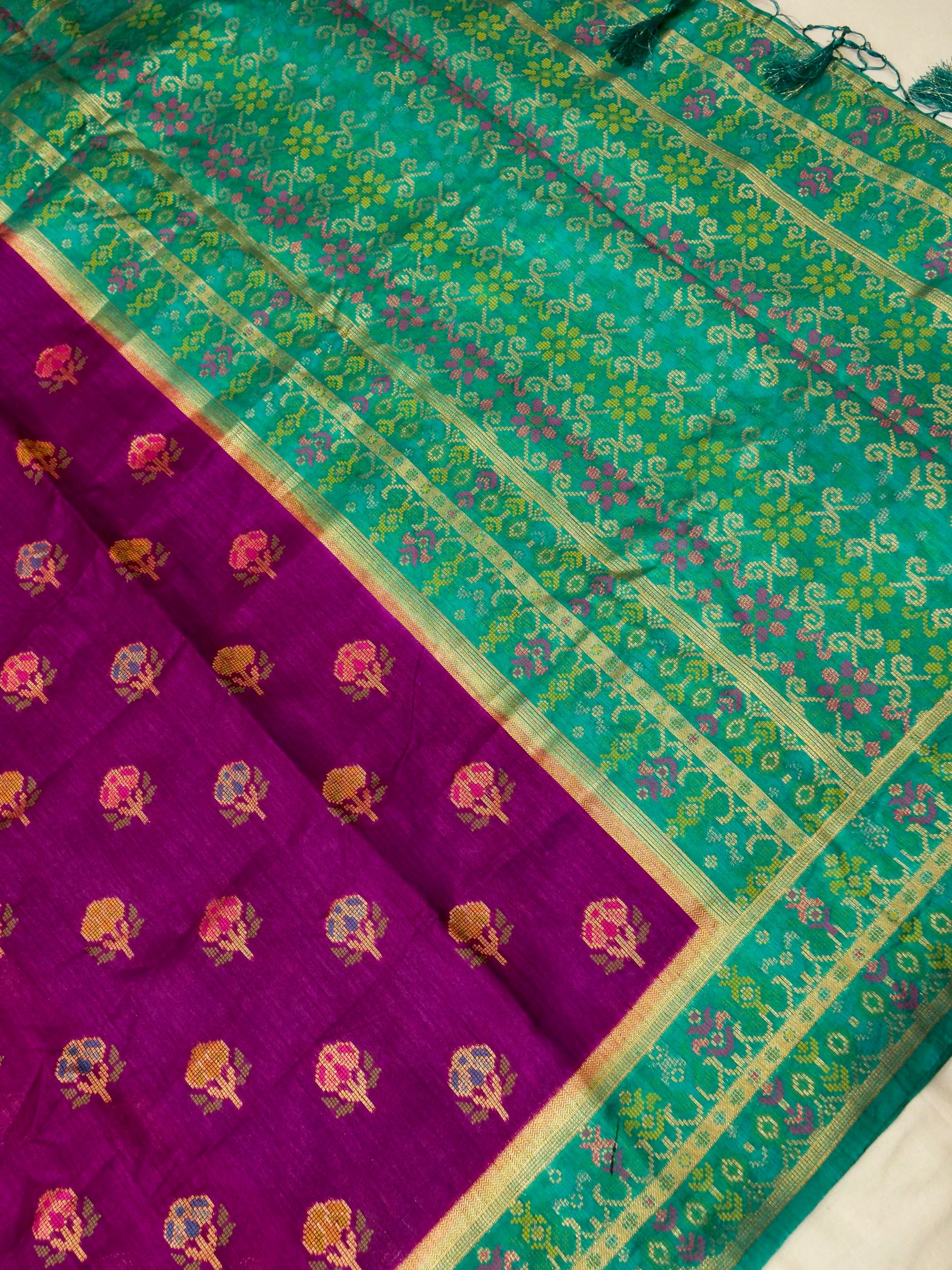 Magenta Patola Silk Saree with Contrast Peacock Green Floral Zari Border