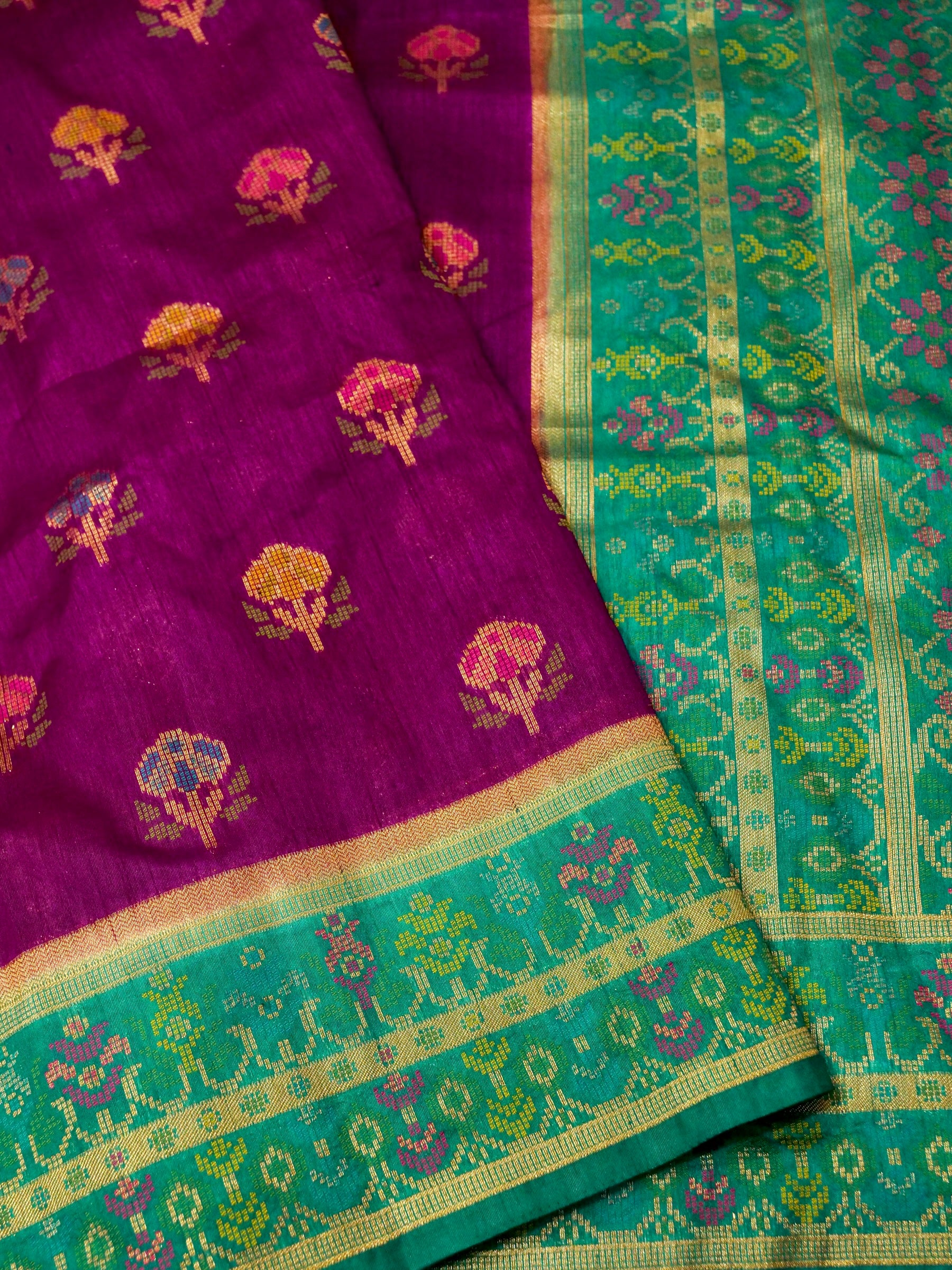 Magenta Patola Silk Saree with Contrast Peacock Green Floral Zari Border