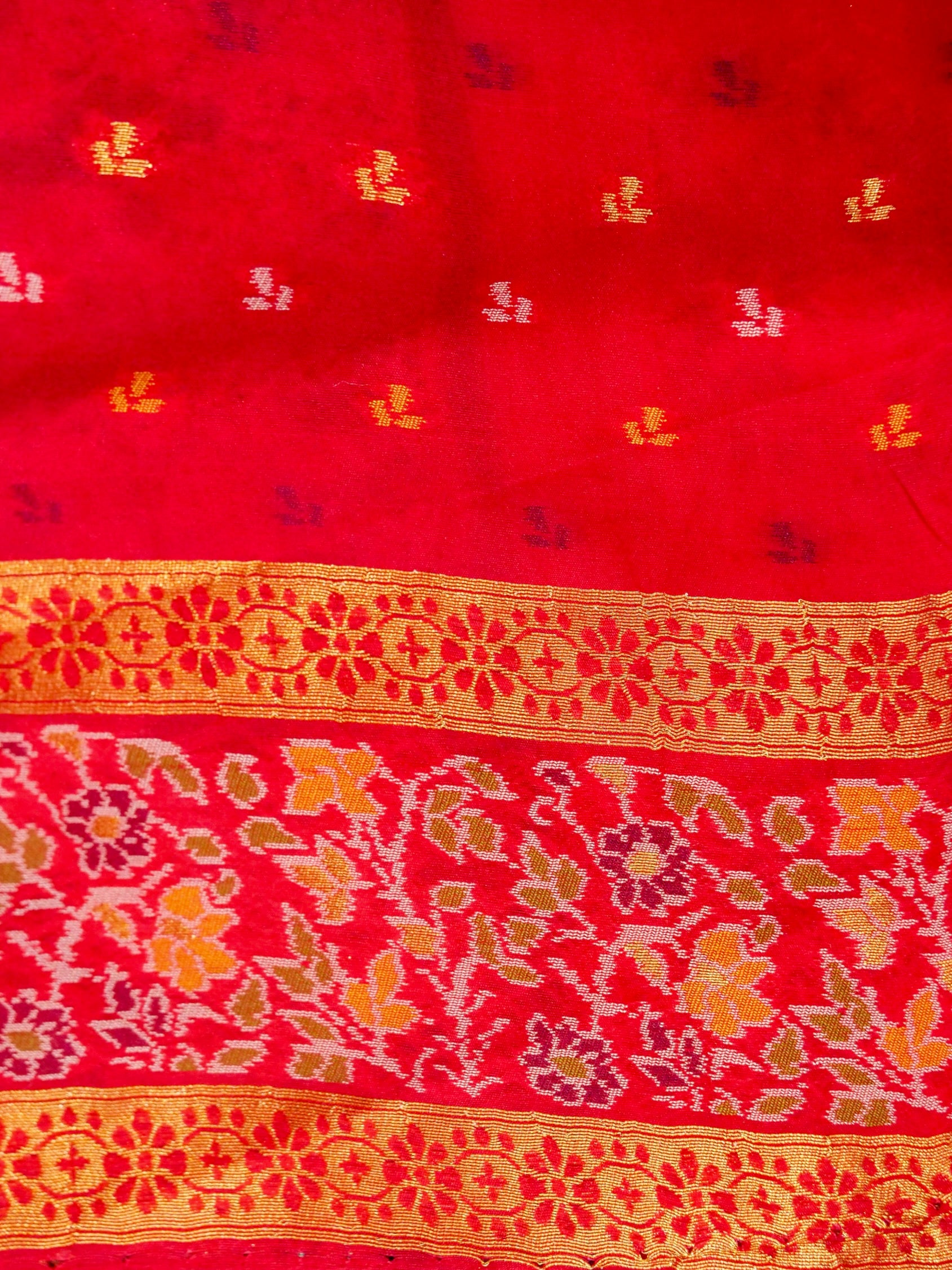 Sea Green Patola Silk Saree with Contrast Rani Pink Floral Zari Border