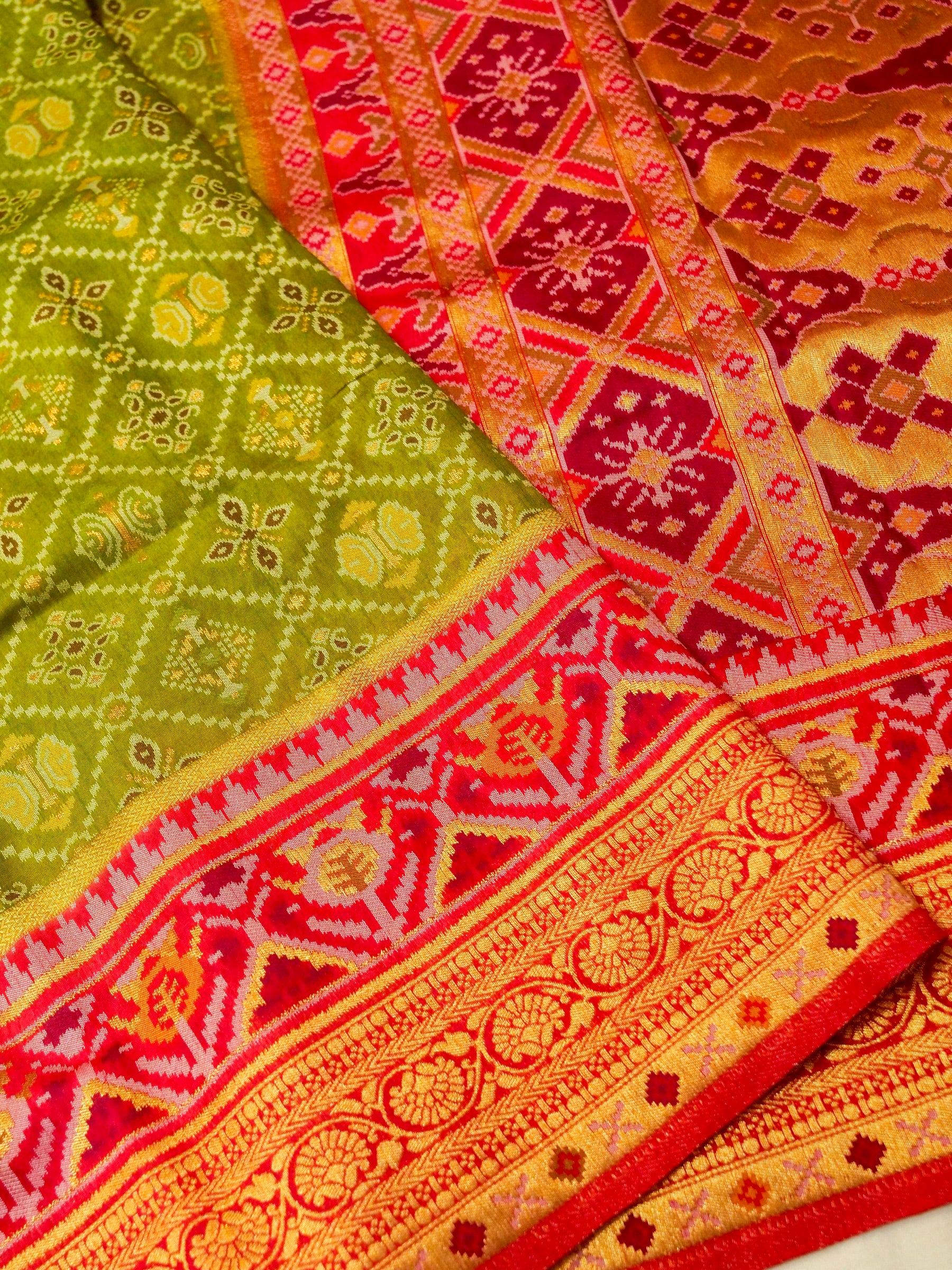 Olive Green Patola Silk Saree with Contrast Rani Pink Border