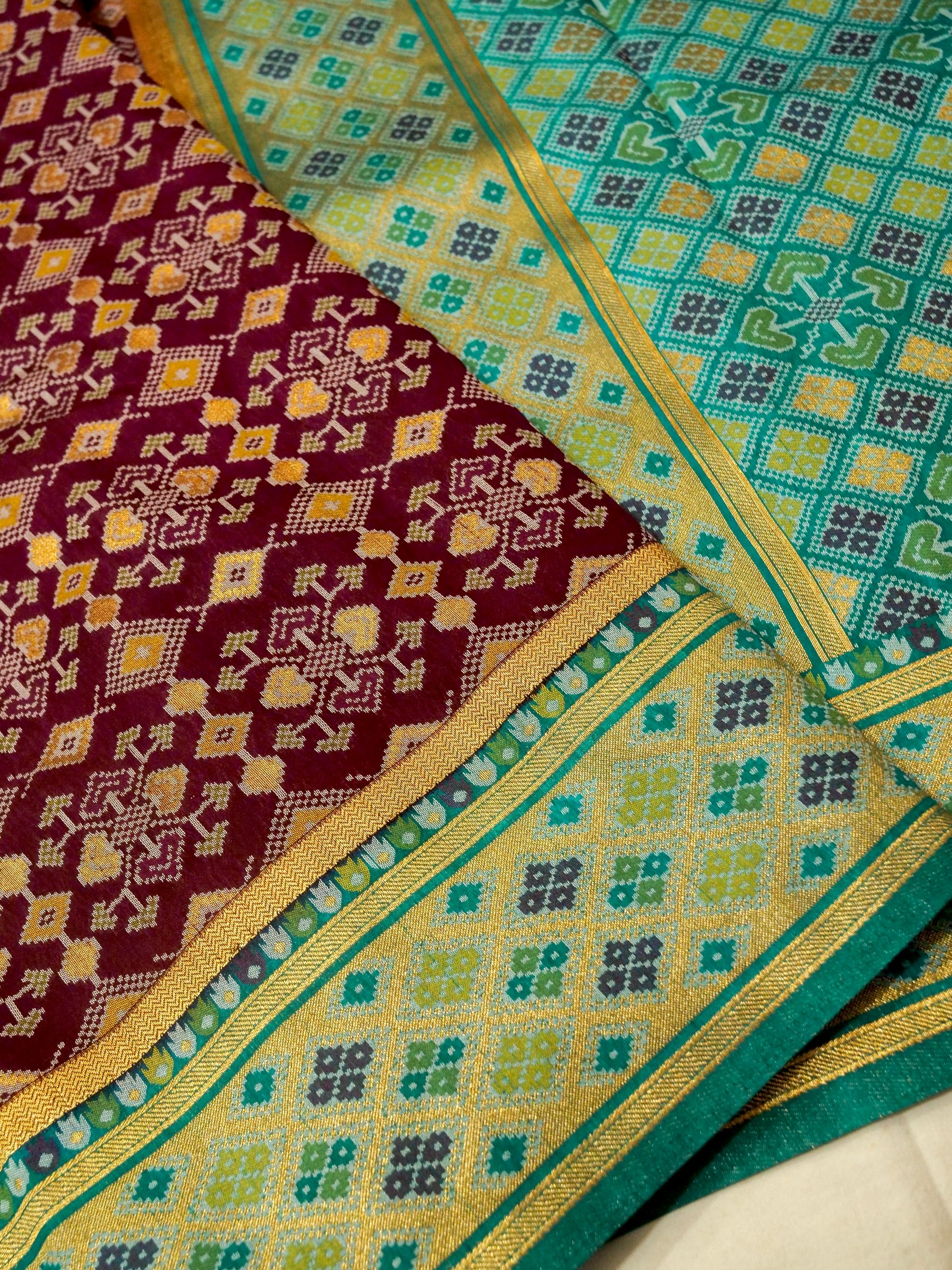 Burgundy Patola Silk Saree with Contrast Teal Border