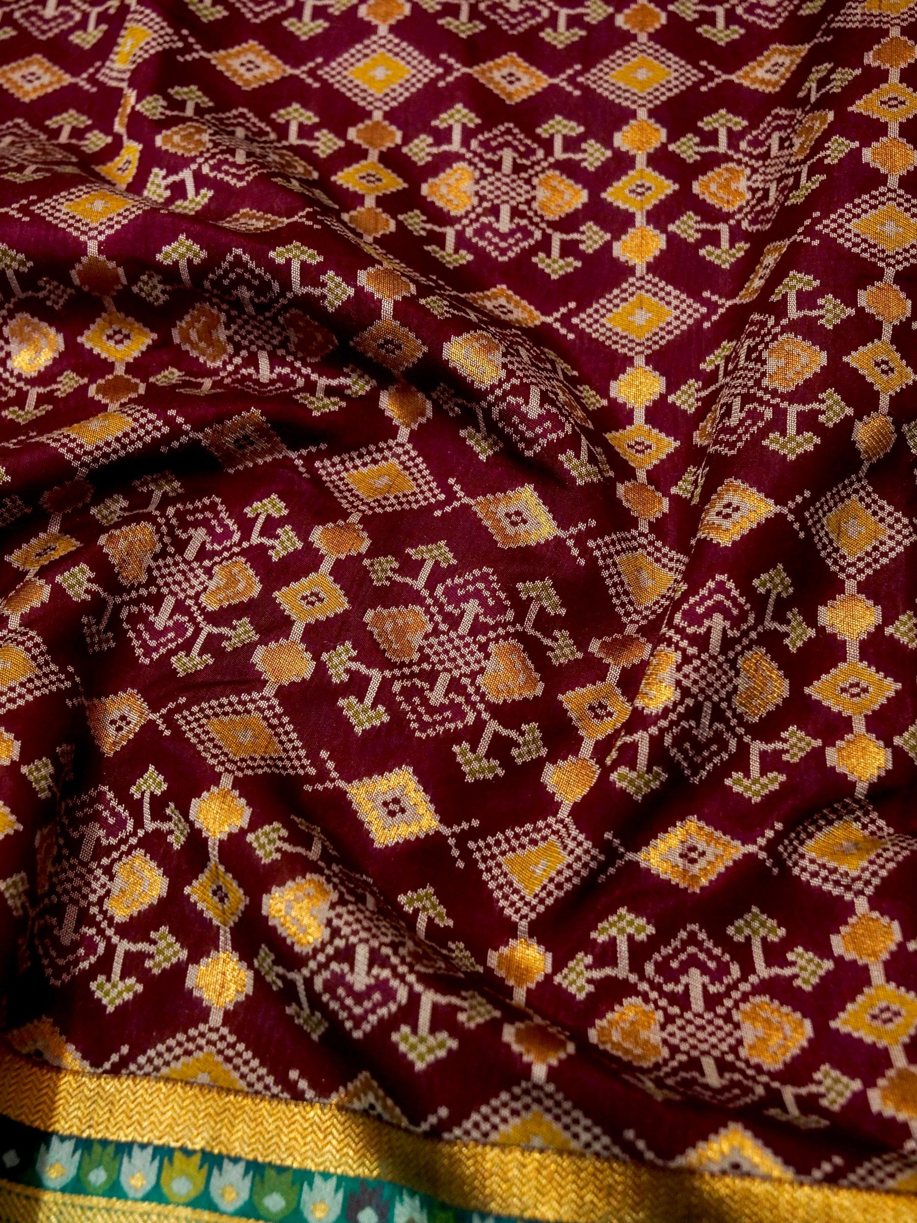 Burgundy Patola Silk Saree with Contrast Teal Border