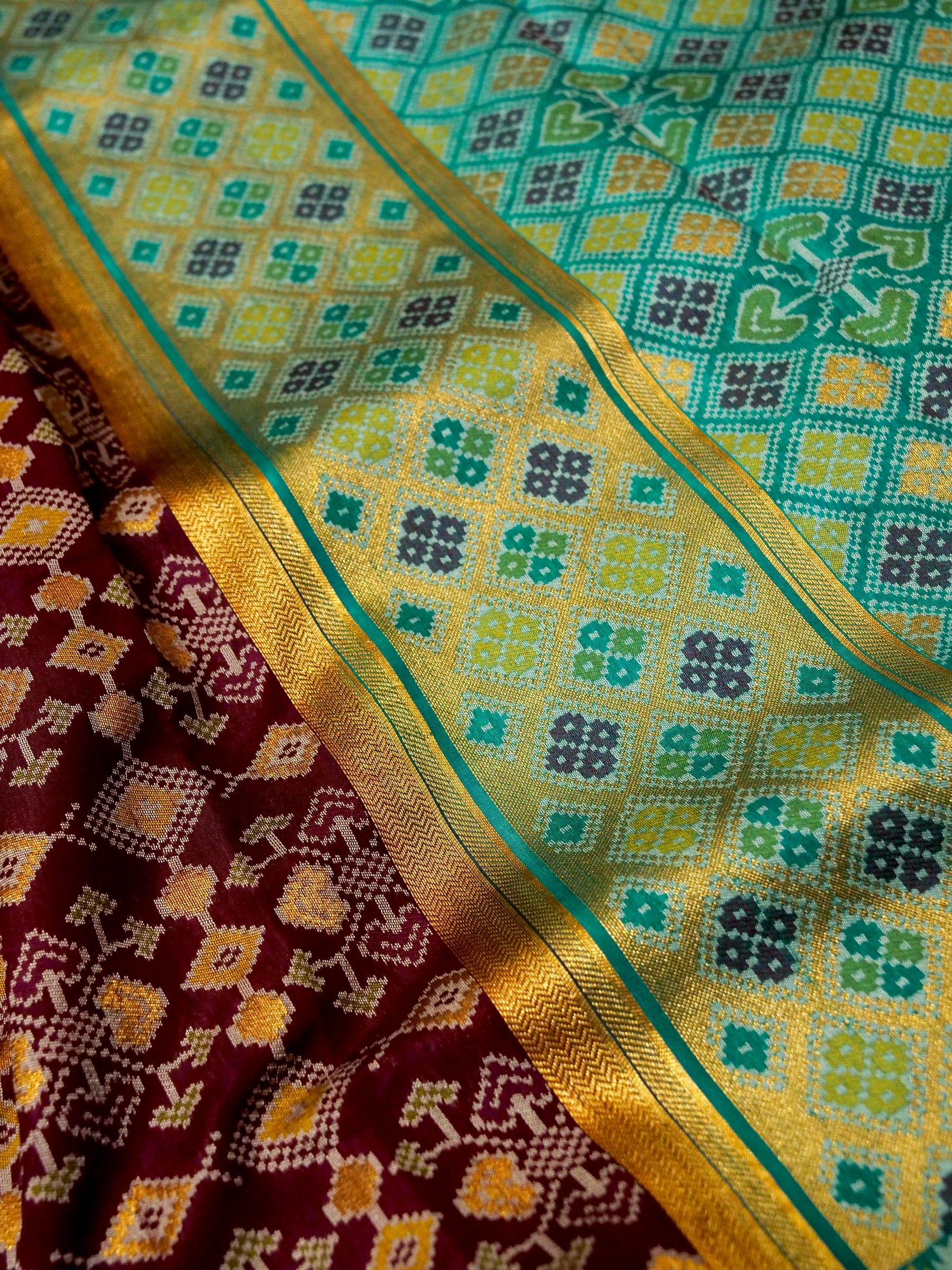 Burgundy Patola Silk Saree with Contrast Teal Border