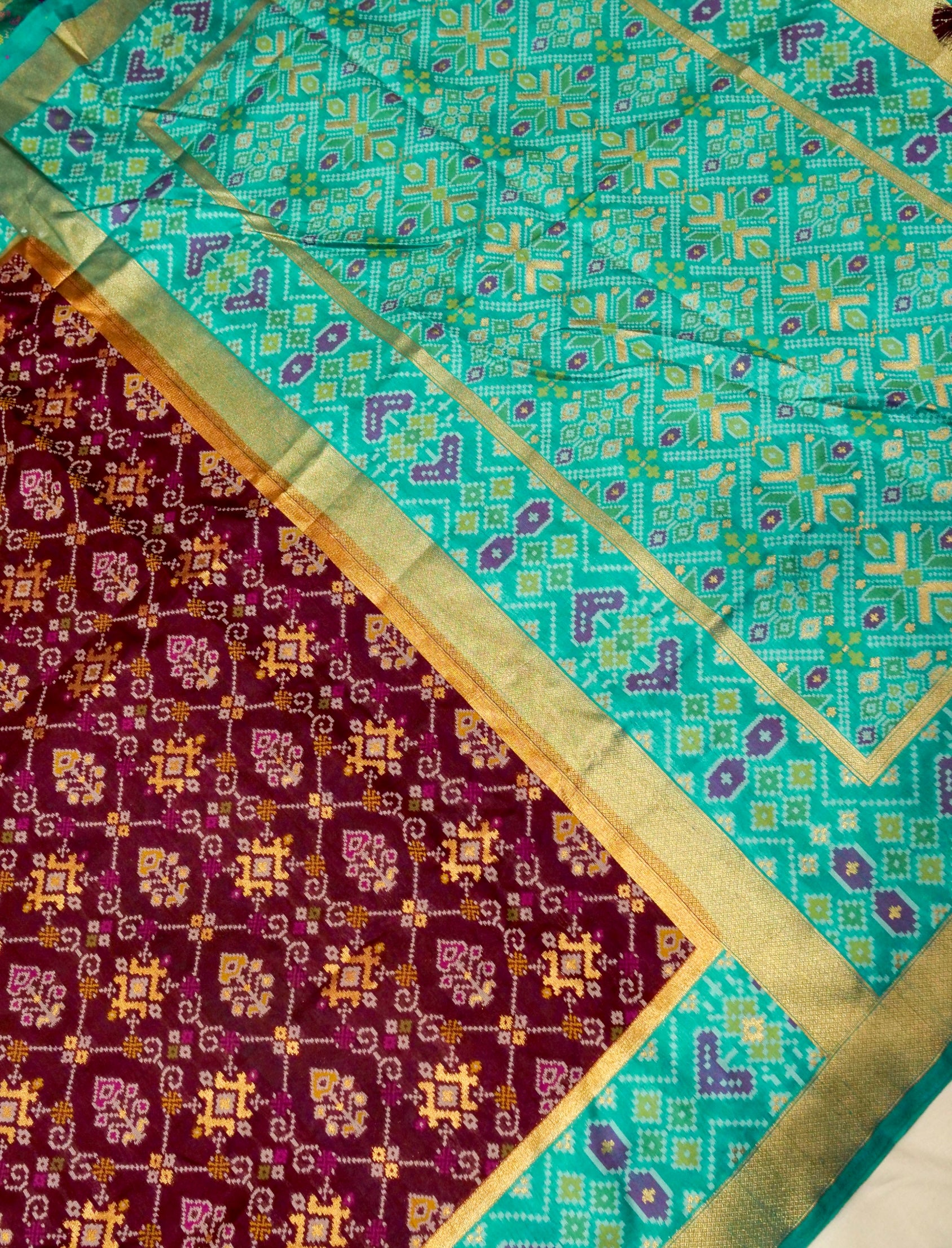 Rich Wine Patola Silk Saree with Contrast Sea Green Border
