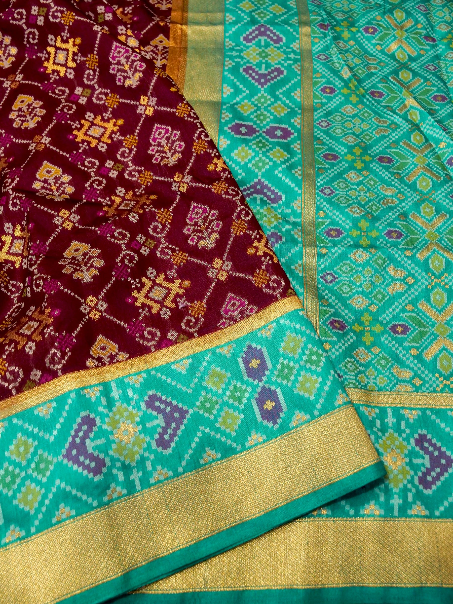 Rich Wine Patola Silk Saree with Contrast Sea Green Border