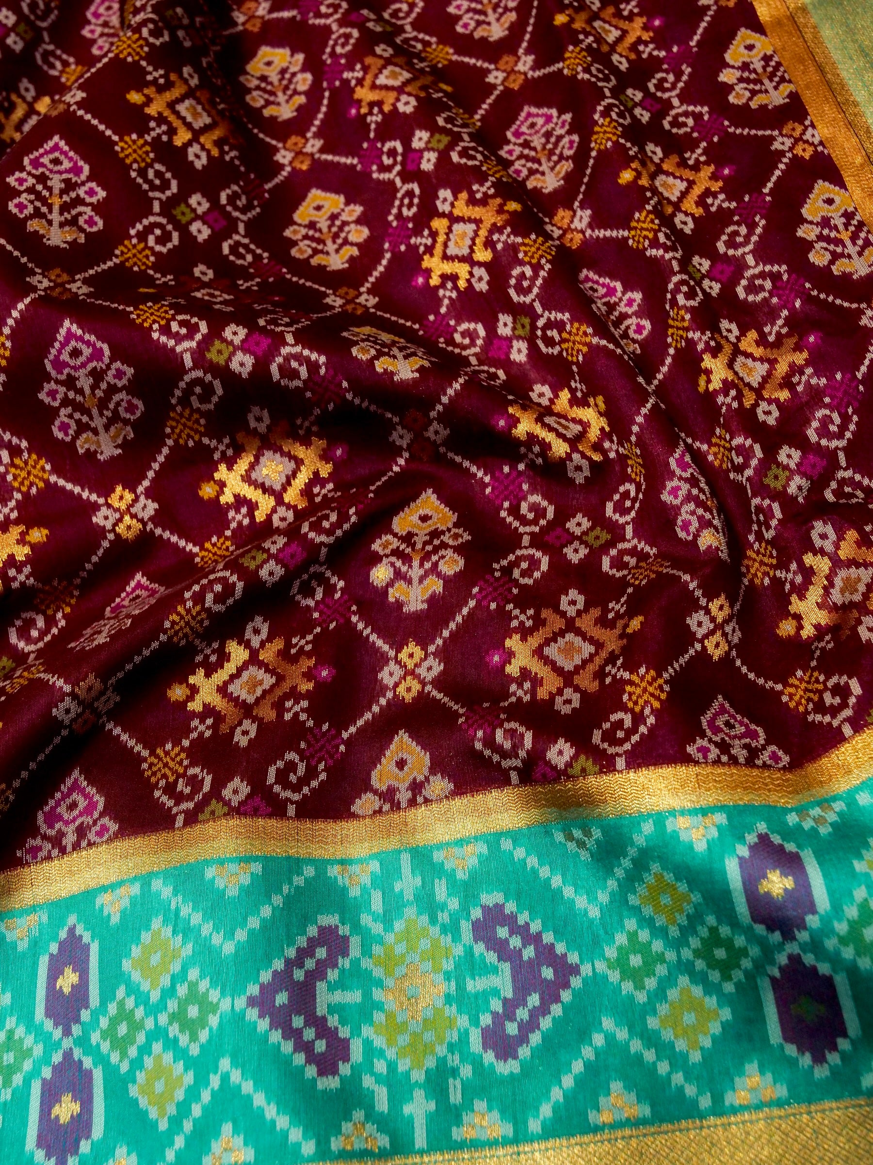 Rich Wine Patola Silk Saree with Contrast Sea Green Border