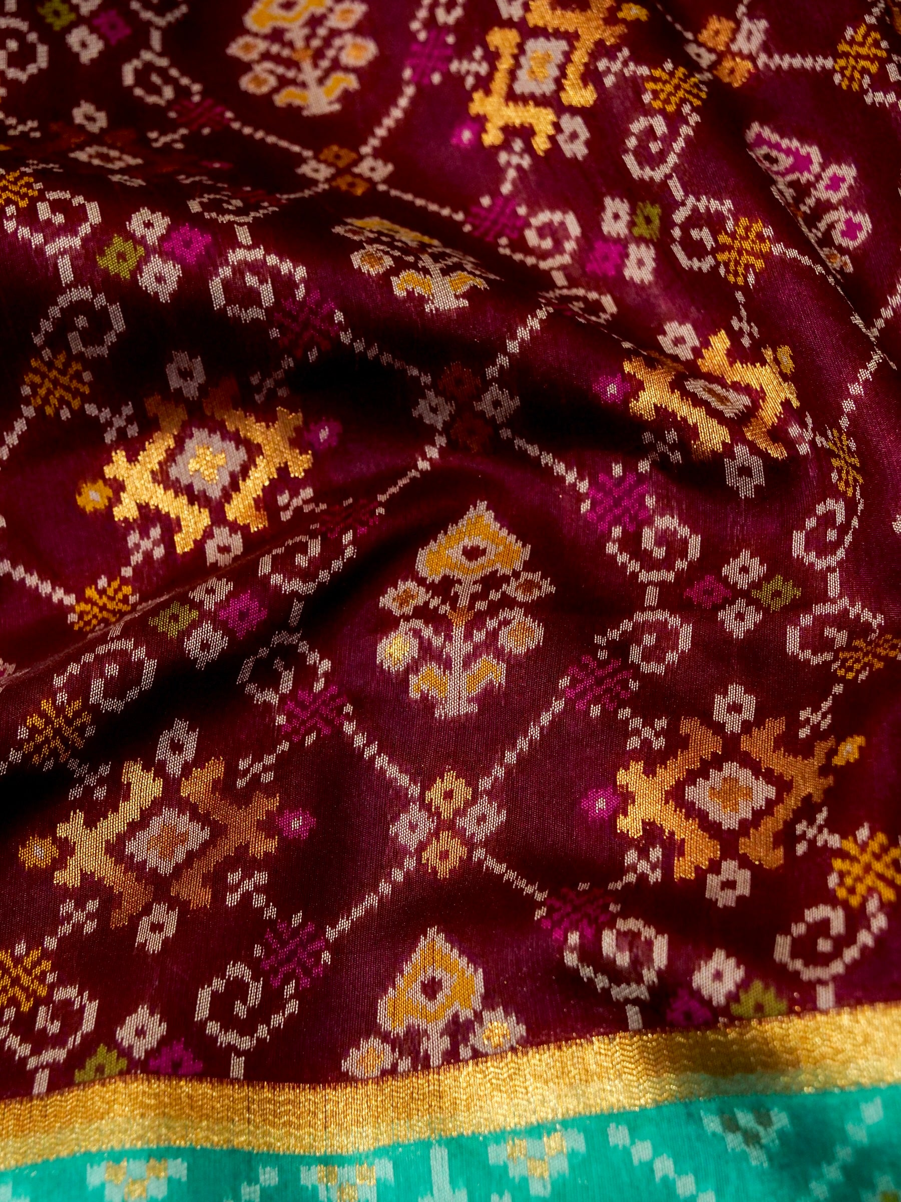 Rich Wine Patola Silk Saree with Contrast Sea Green Border