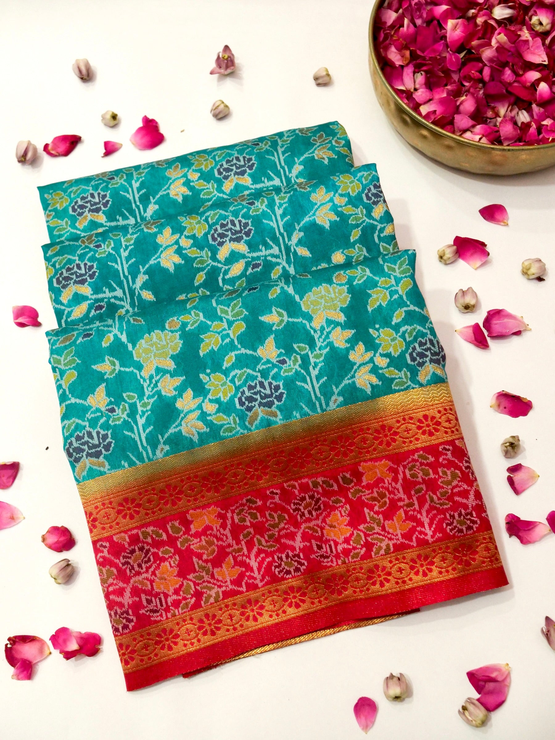 Sea Green Patola Silk Saree with Contrast Rani Pink Floral Zari Border