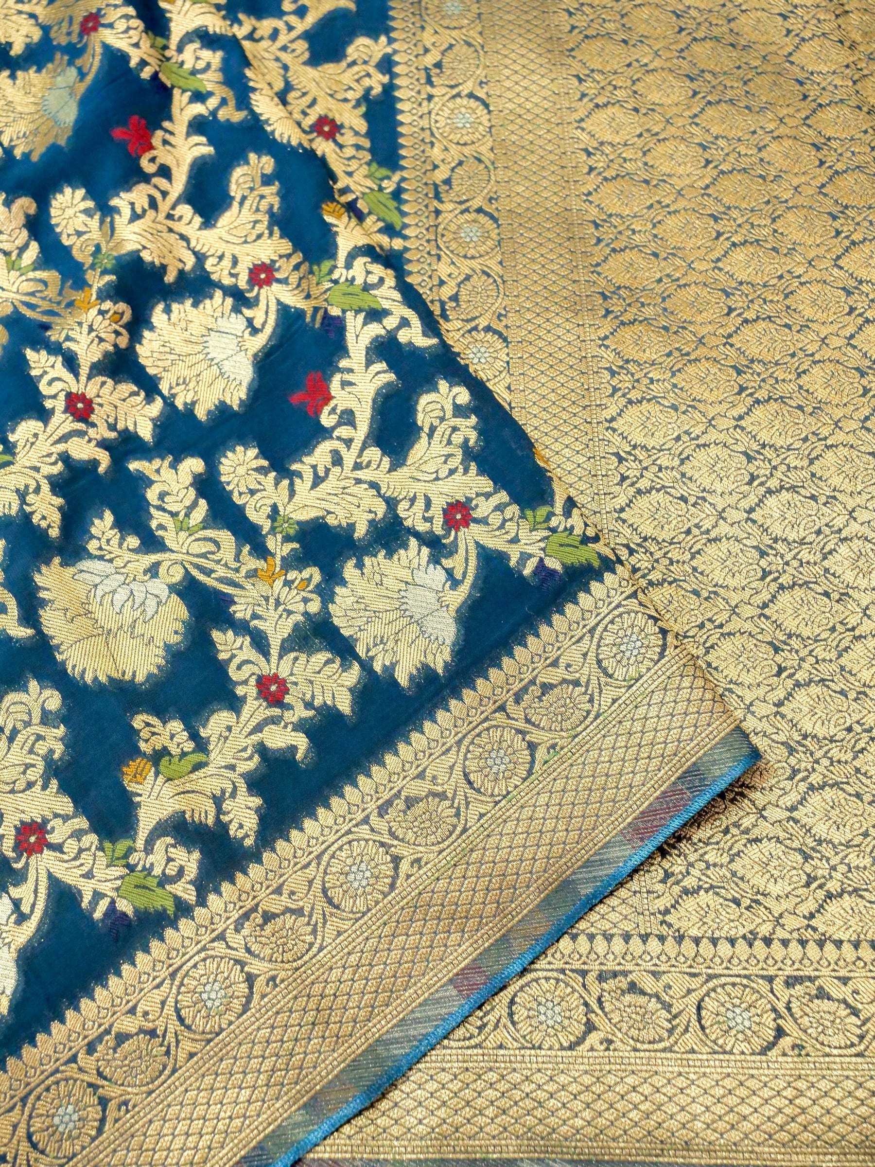 Peacock Blue Crepe Georgette Silk Saree with Gold Border