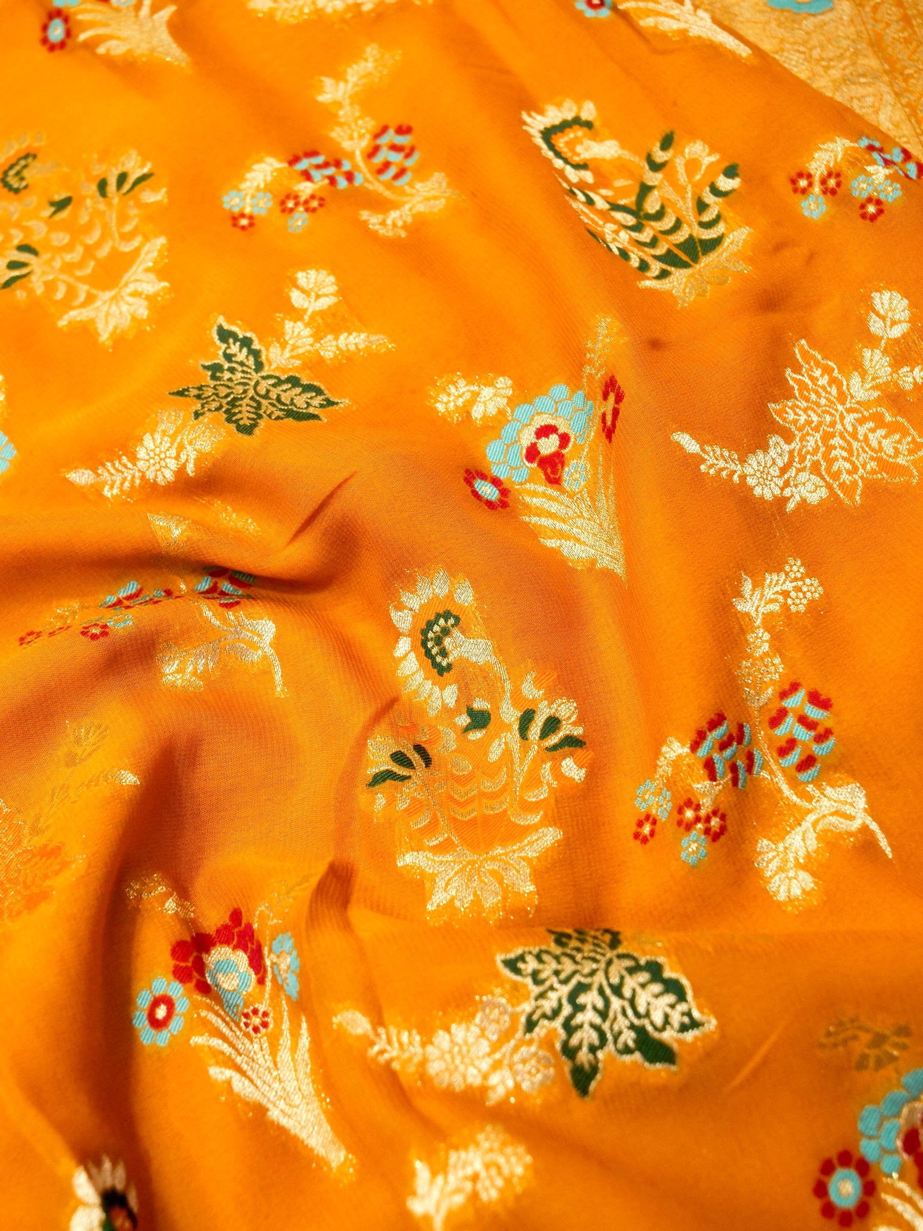Mustard Orange Crepe Georgette Silk Saree with Champagne Gold Border