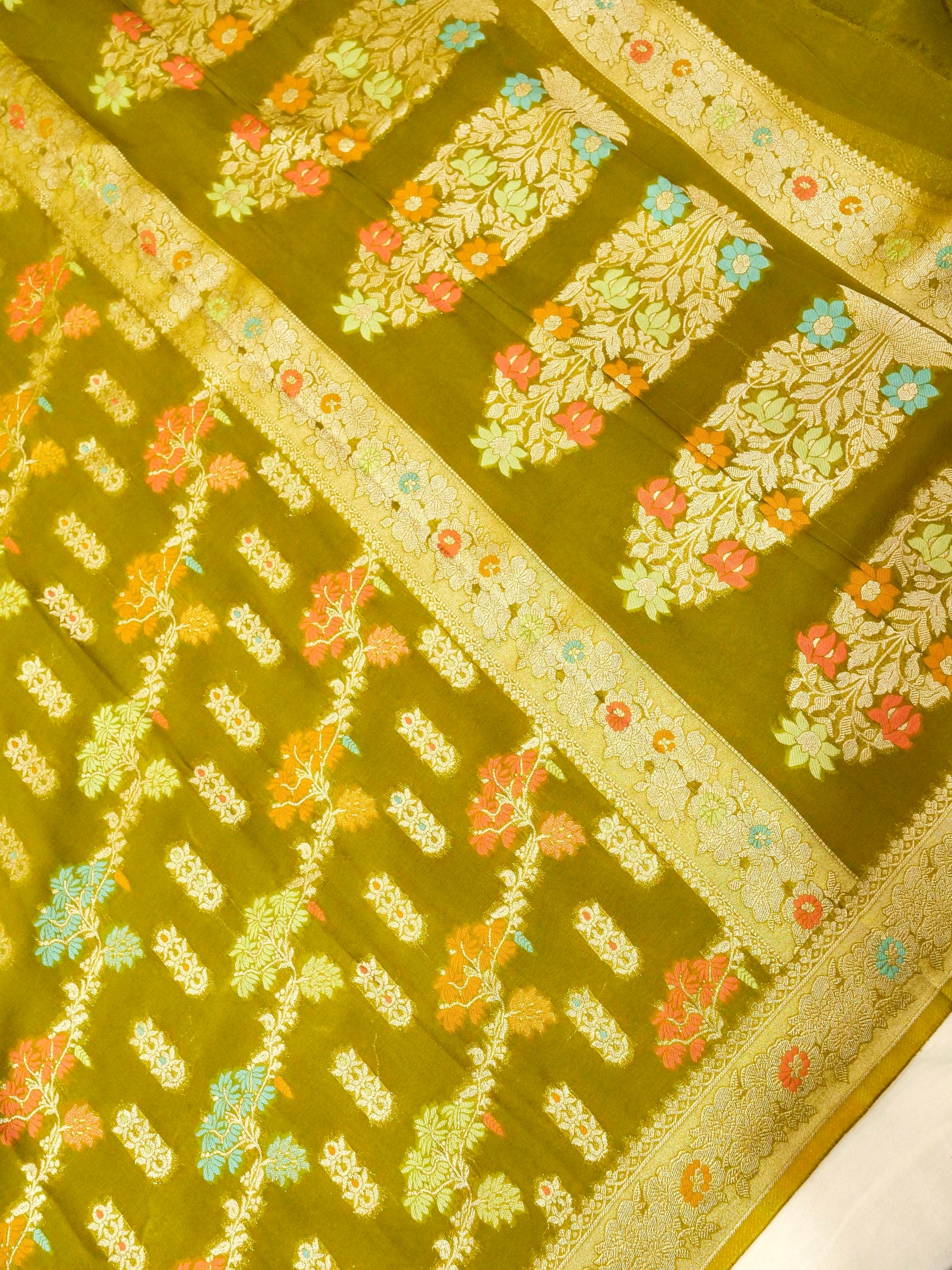 Moss Green Crepe Georgette Silk Saree with Champagne Border