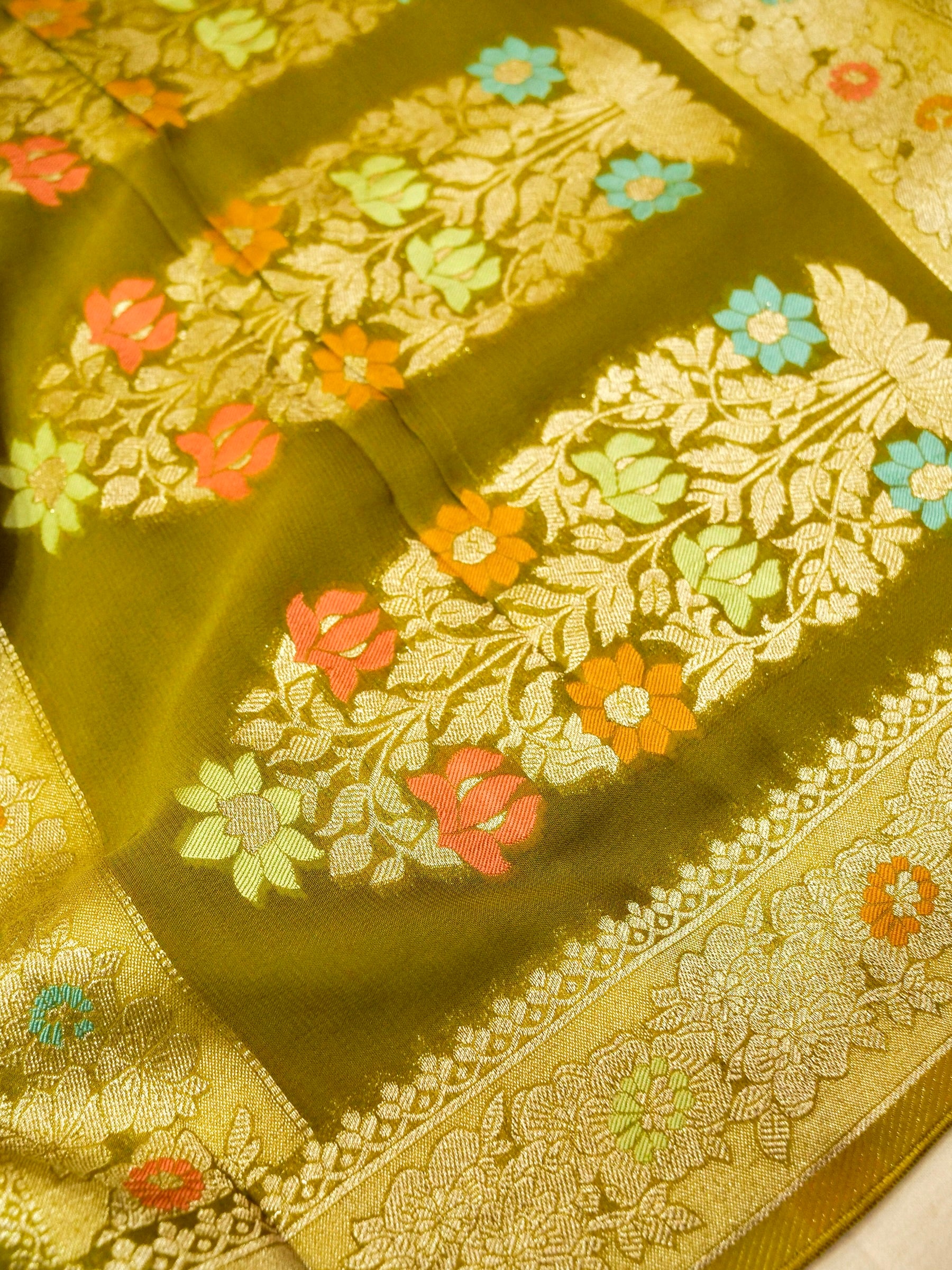 Moss Green Crepe Georgette Silk Saree with Champagne Border