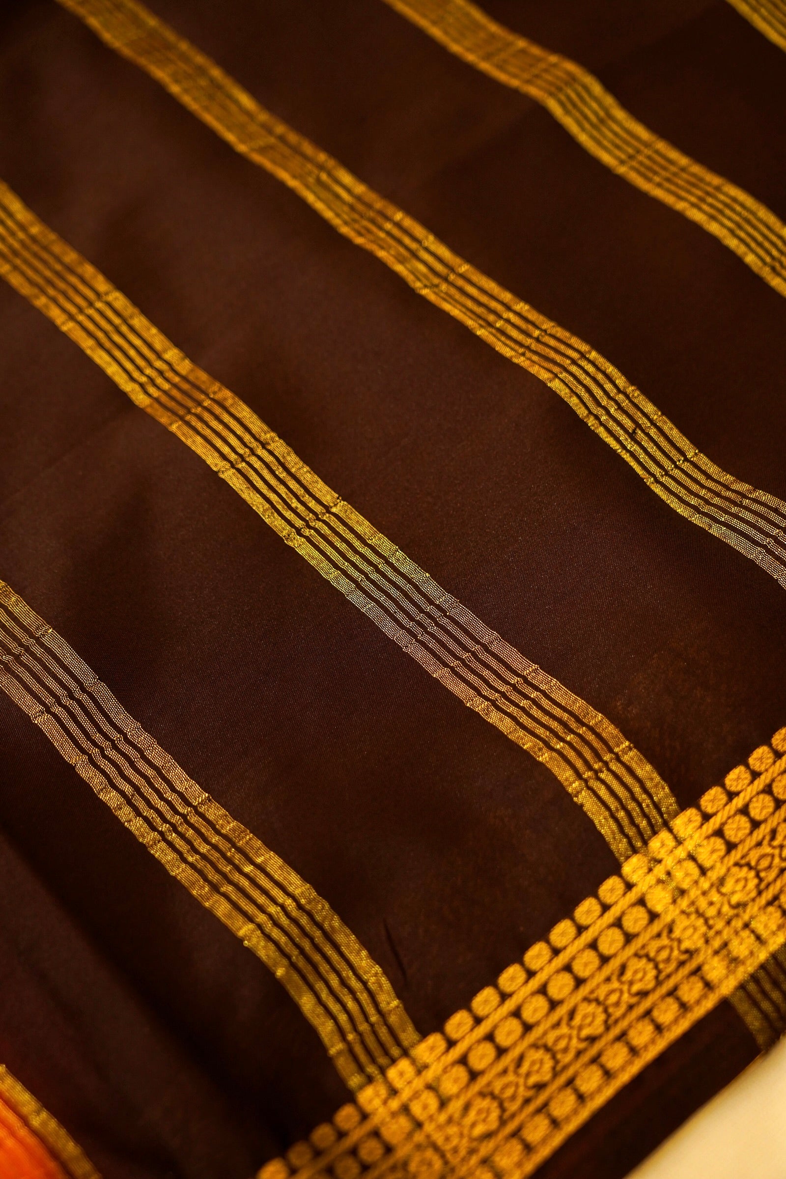 Maithili - Orange Mysore Crepe Silk Saree with Dark Brown Border