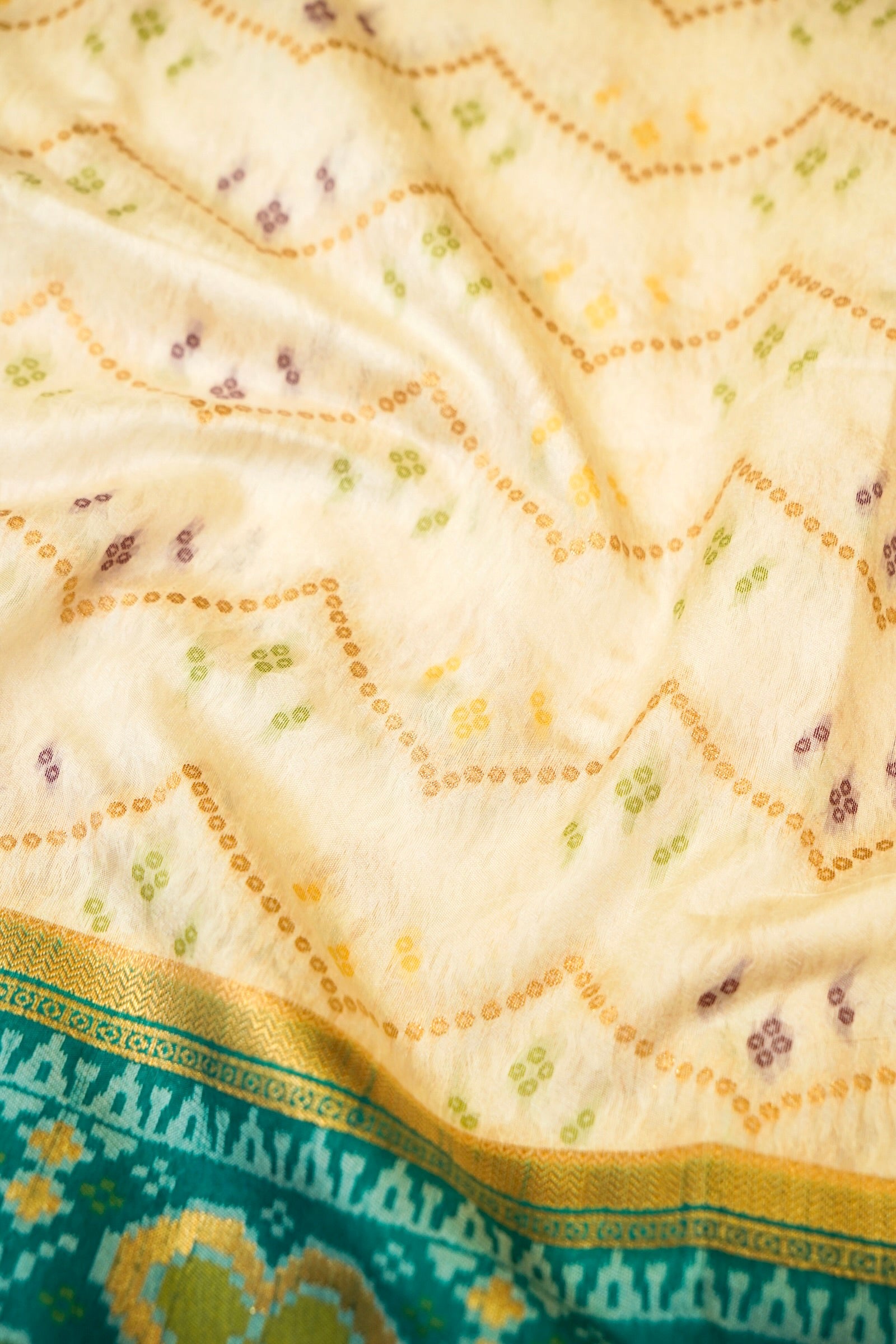 Ivory Ikkat Patola Silk Saree with Teal Border and Stitched Blouse