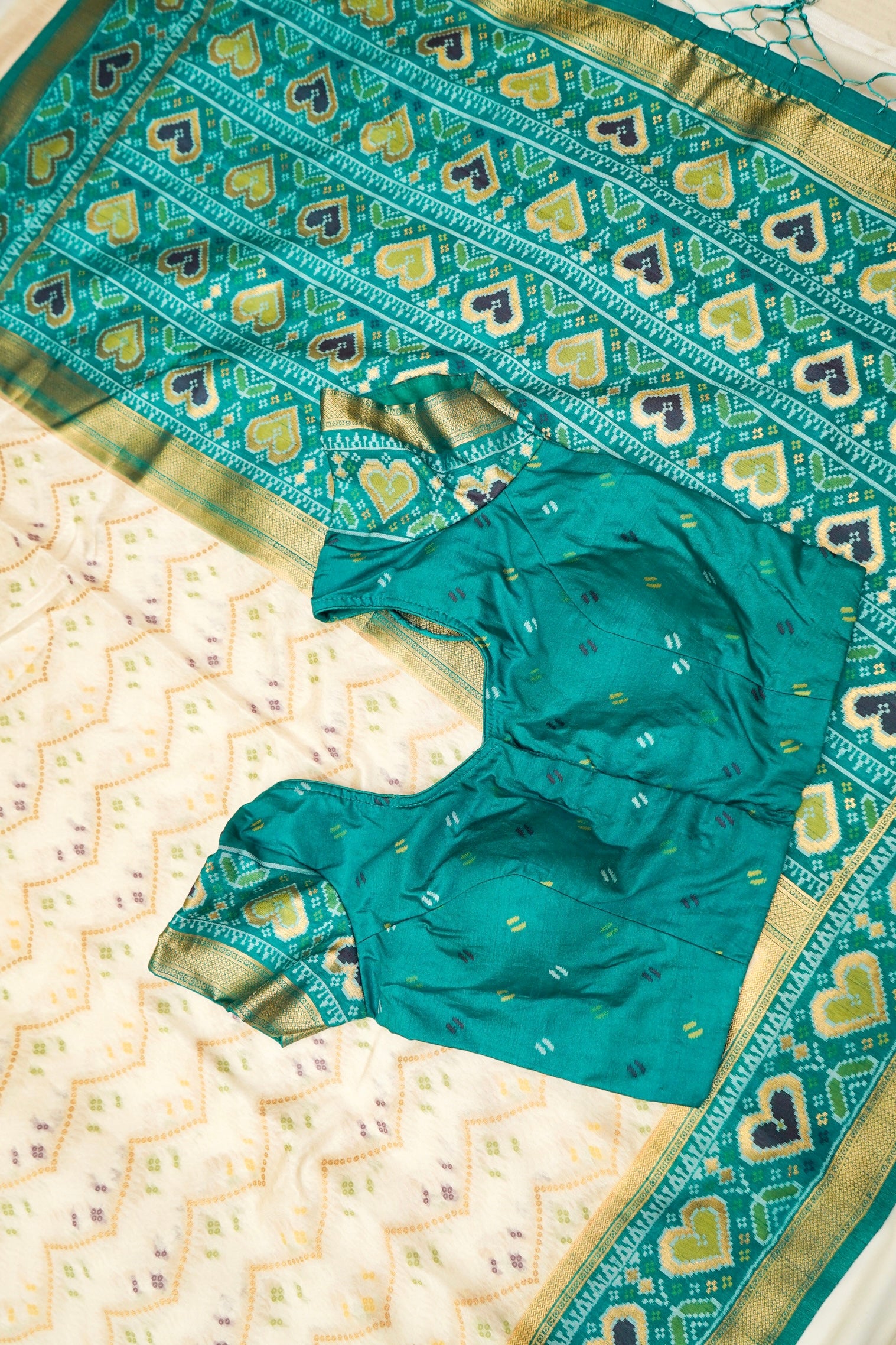 Ivory Ikkat Patola Silk Saree with Teal Border and Stitched Blouse