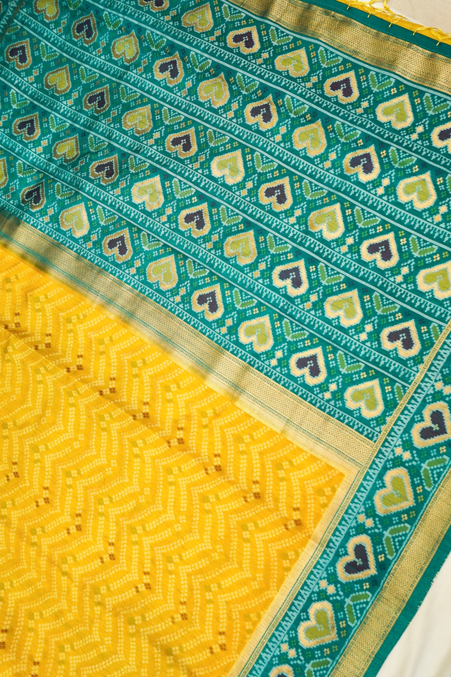 Mustard Yellow Ikkat Patola Silk Saree with Teal Border and Stitched Blouse