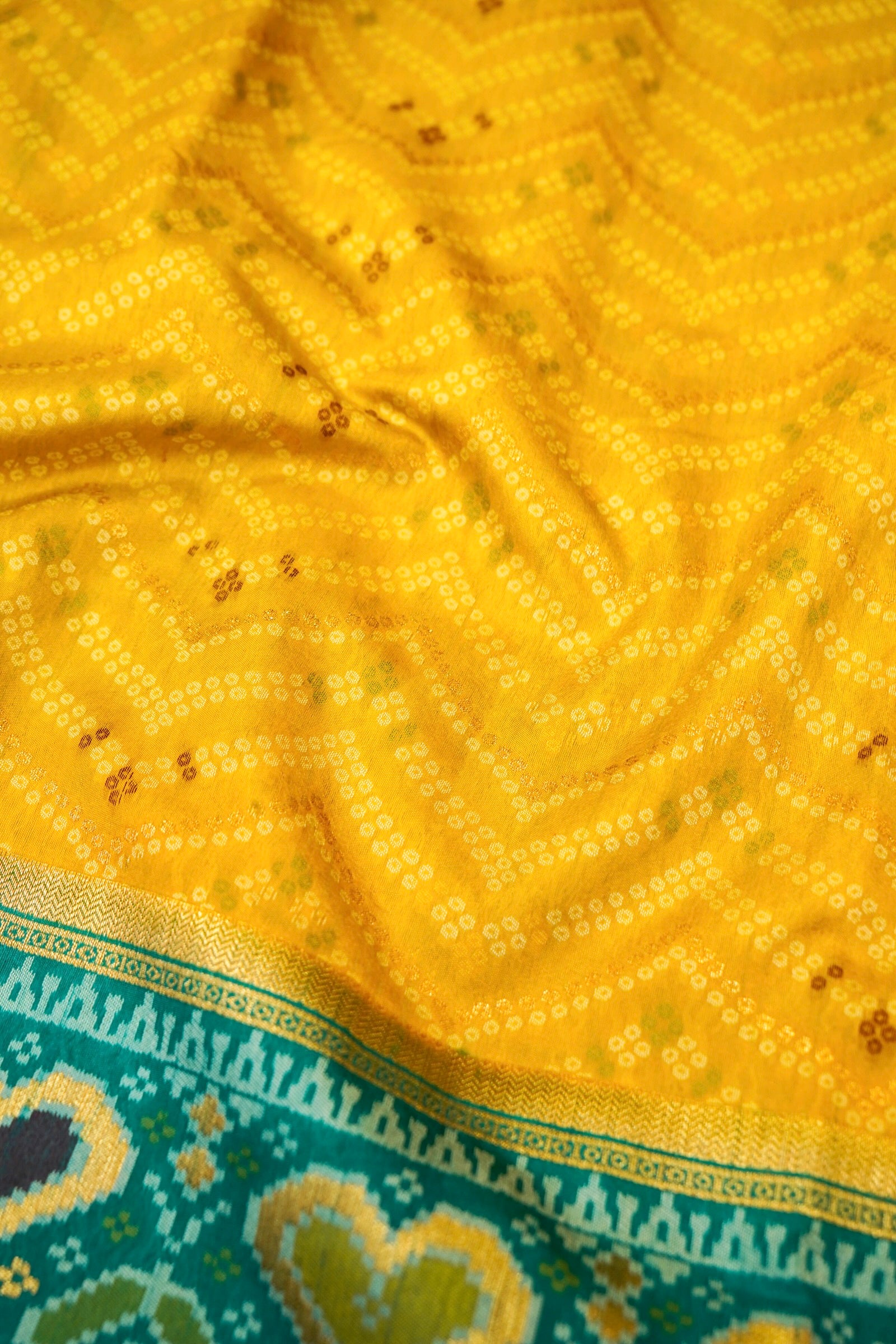 Mustard Yellow Ikkat Patola Silk Saree with Teal Border and Stitched Blouse
