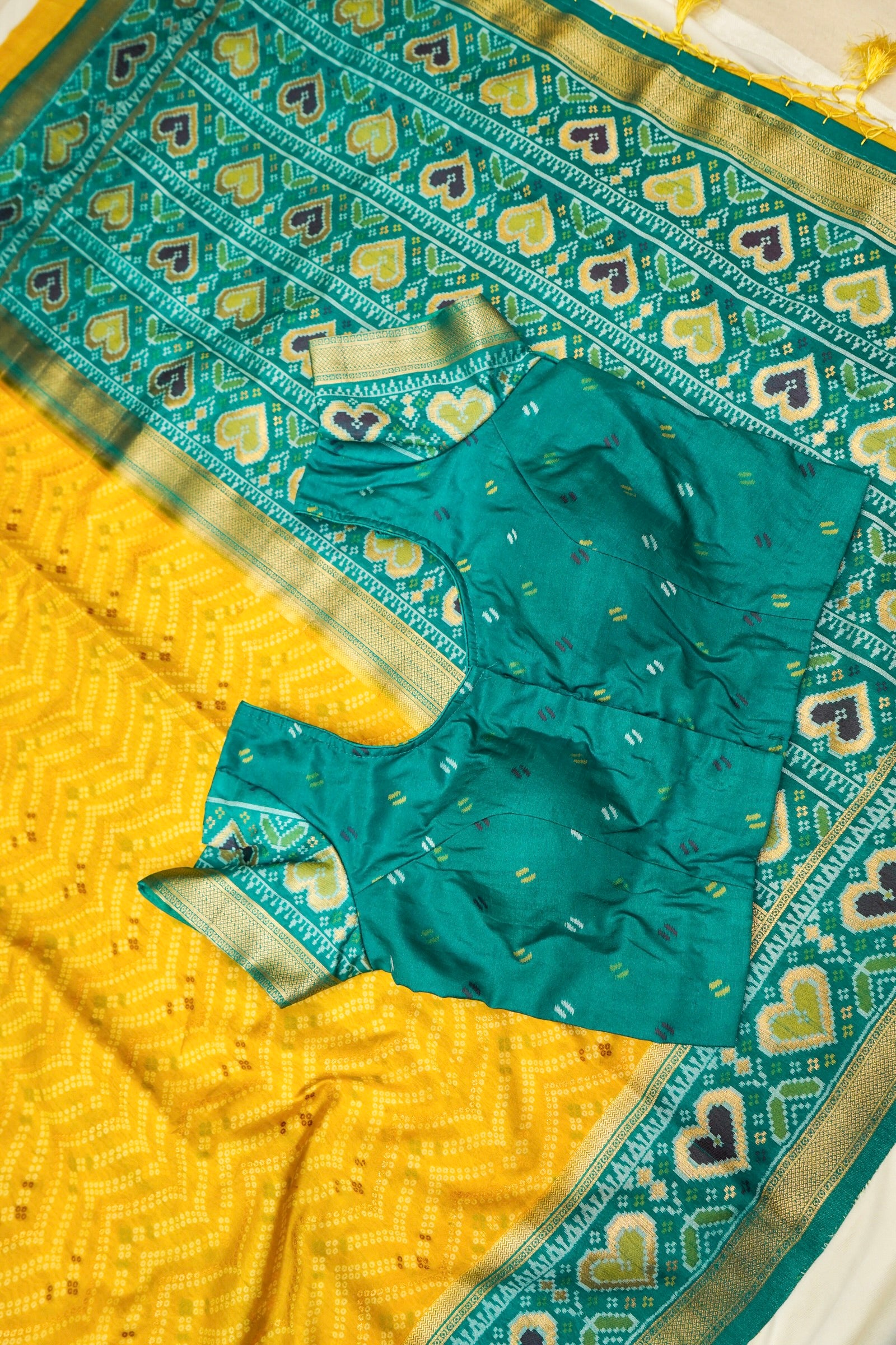 Mustard Yellow Ikkat Patola Silk Saree with Teal Border and Stitched Blouse