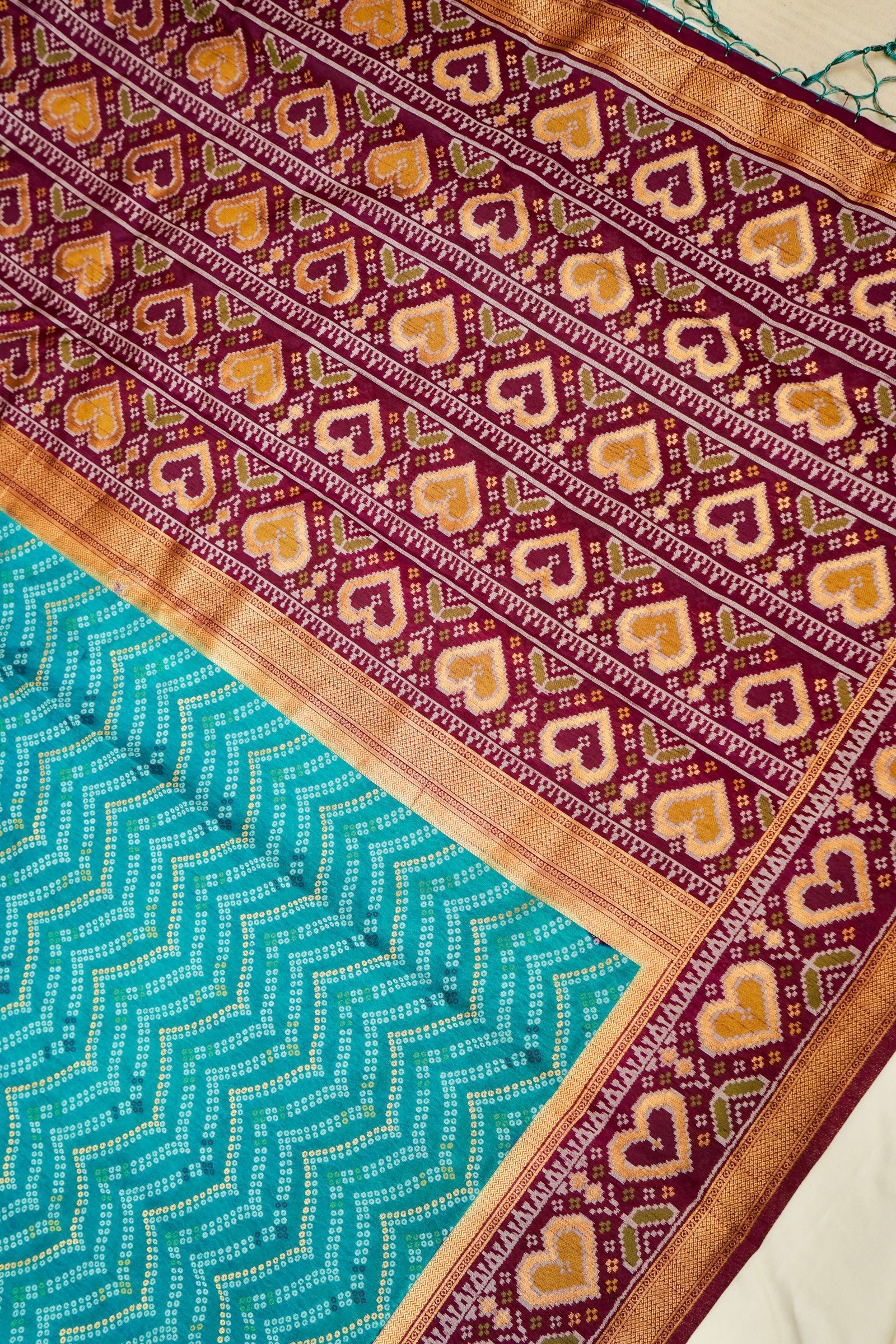 Turquoise Blue Ikkat Patola Silk Saree with Wine Border and Stitched Blouse