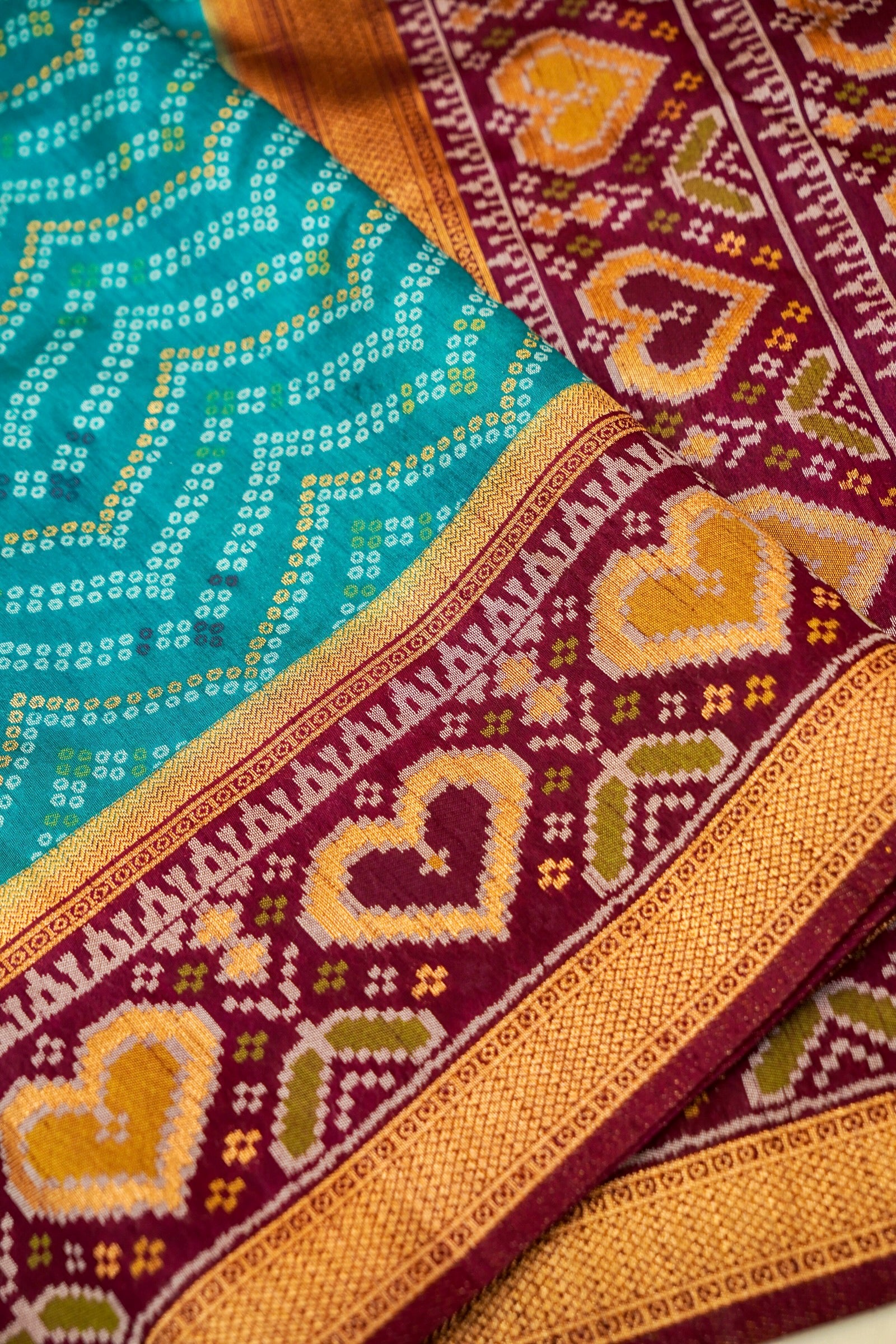 Turquoise Blue Ikkat Patola Silk Saree with Wine Border and Stitched Blouse