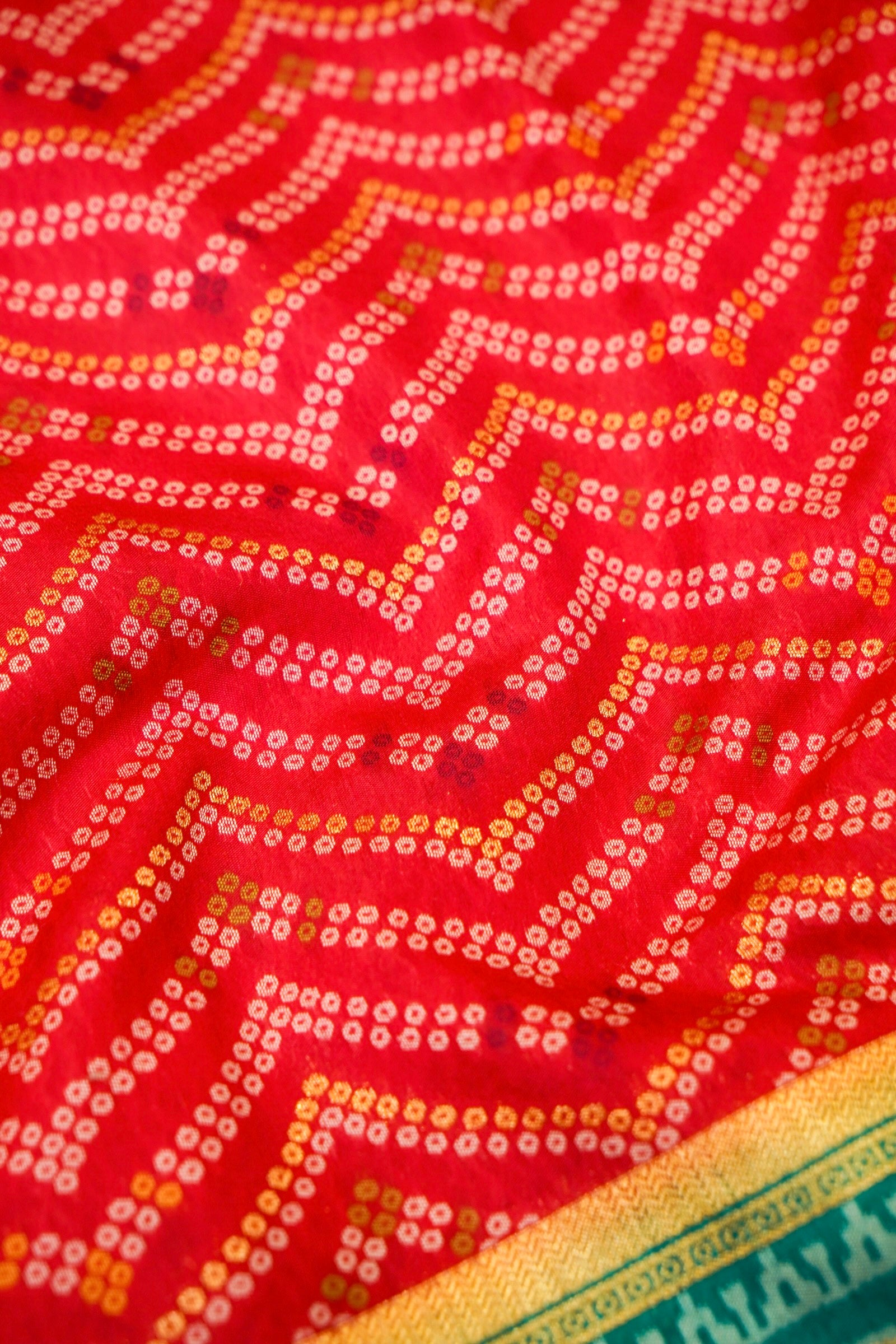 Bright Red Ikkat Patola Silk Saree with Teal Border and Stitched Blouse