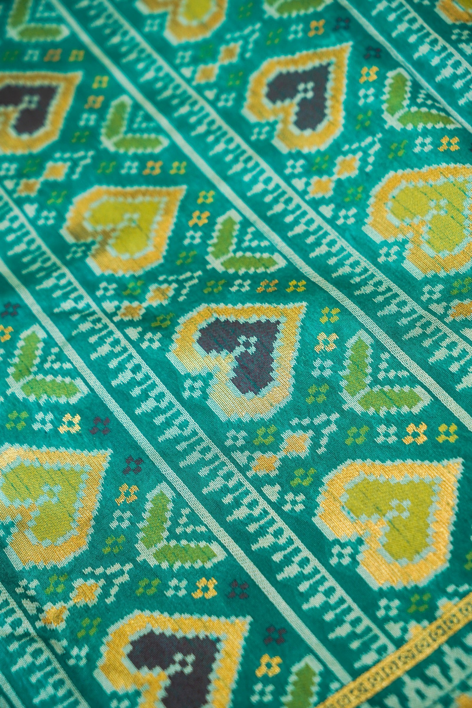 Bright Red Ikkat Patola Silk Saree with Teal Border and Stitched Blouse