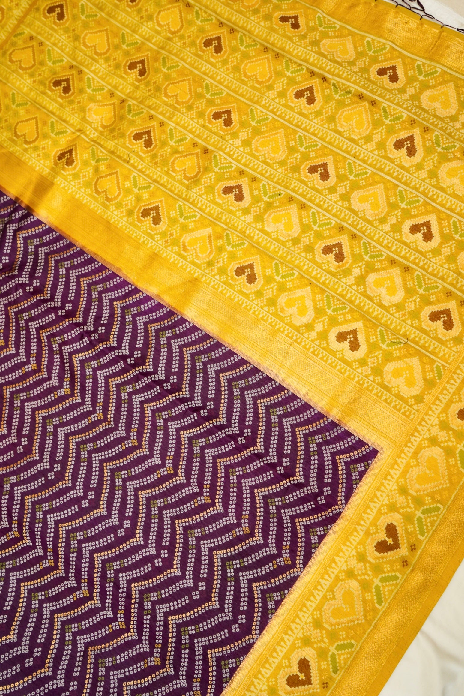 Deep Plum Ikkat Patola Silk Saree with Mustard Border and Stitched Blouse