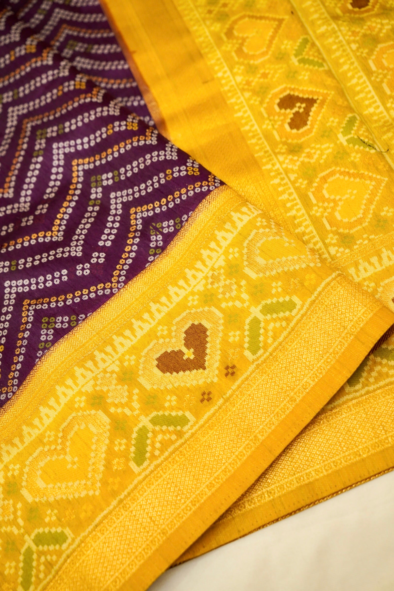 Deep Plum Ikkat Patola Silk Saree with Mustard Border and Stitched Blouse